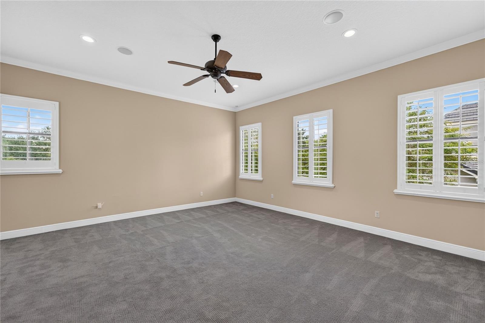 Midway up the stairs lies this large BONUS room with storage closet. The only room with carpet in the house and once used as FITNESS/WELLNESS ROOM. A 
