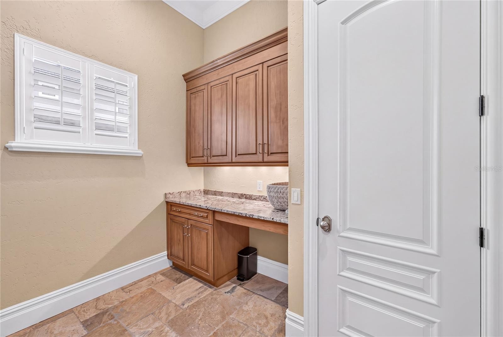 Another view of first floor laundry with storage closet.