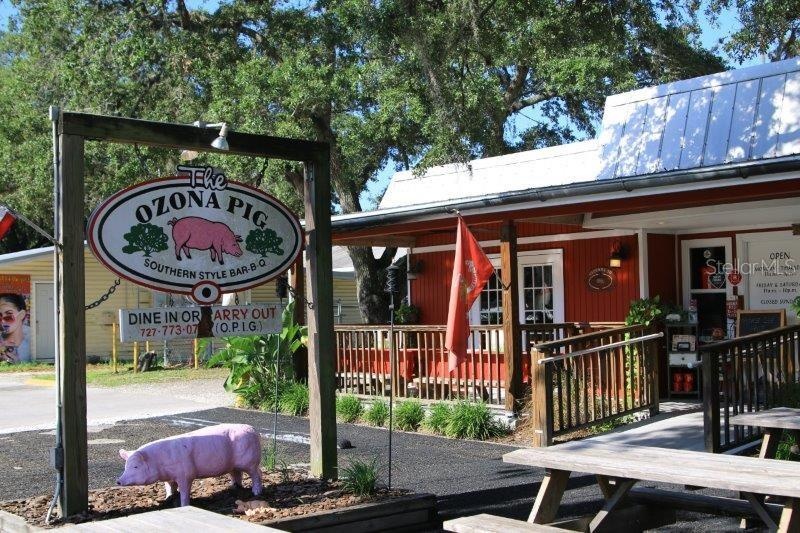 Local favorite Ozona Pig brings casual Southern BBQ right to the neighborhood—one of several Ozona spots easily reached by golf cart.
