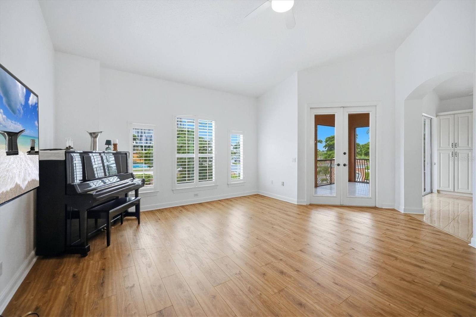 French doors lead to screen porch
