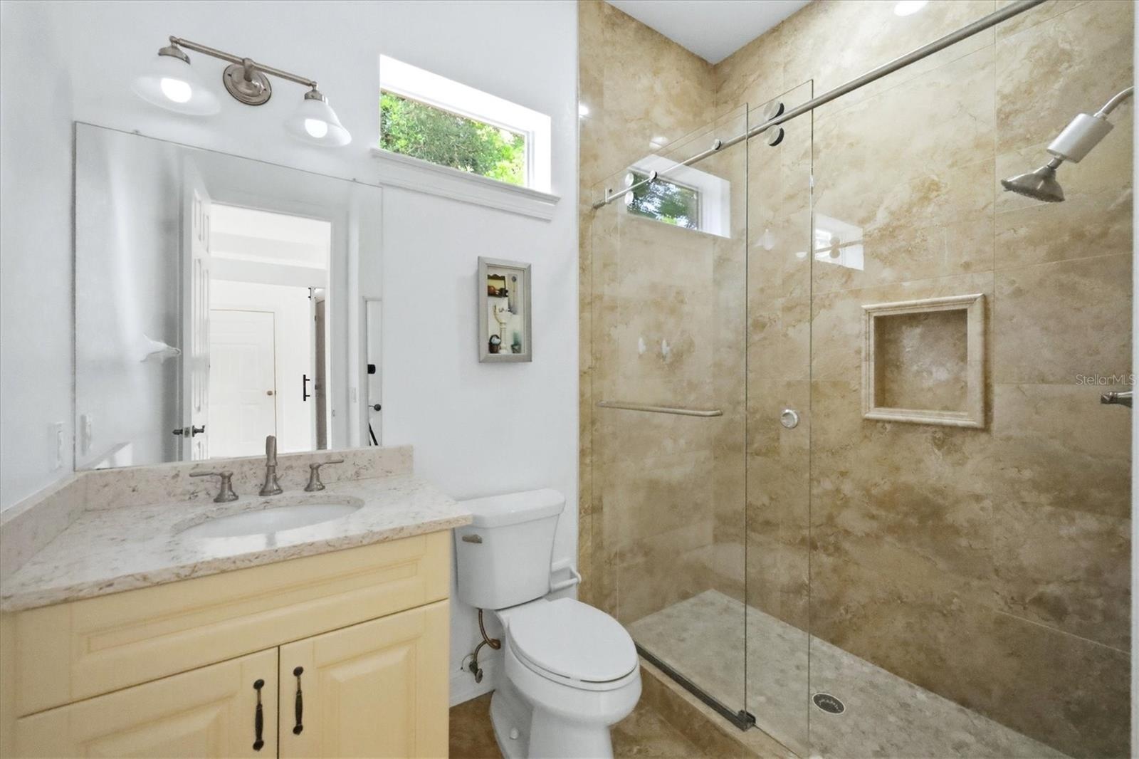 bathroom that Bdrm 3 and 4 share