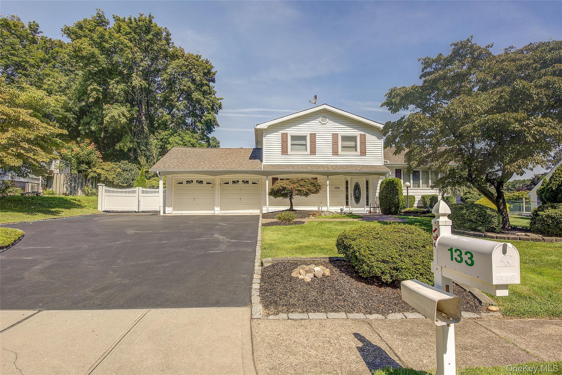 Welcome Home! Note the extra wide driveway and the double gate to the left of the home to park an RV or More Cars