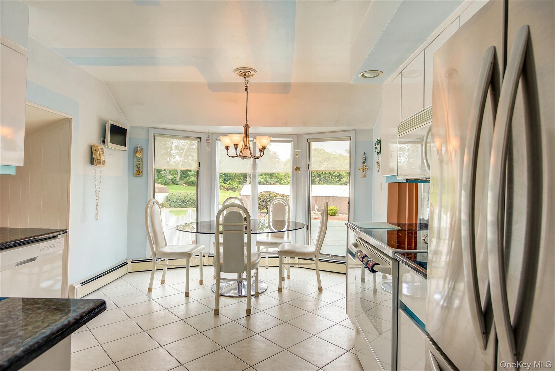 Eat-in kitchen overlooks the built in pool in the yard.