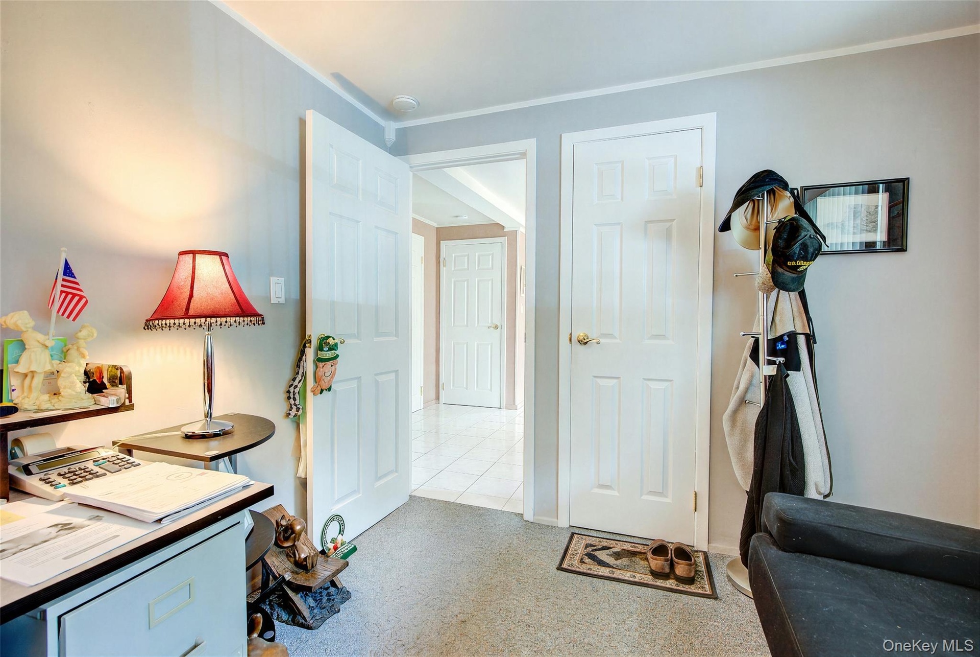 Reverse View of the office  shows entry hall and front door in the foreground