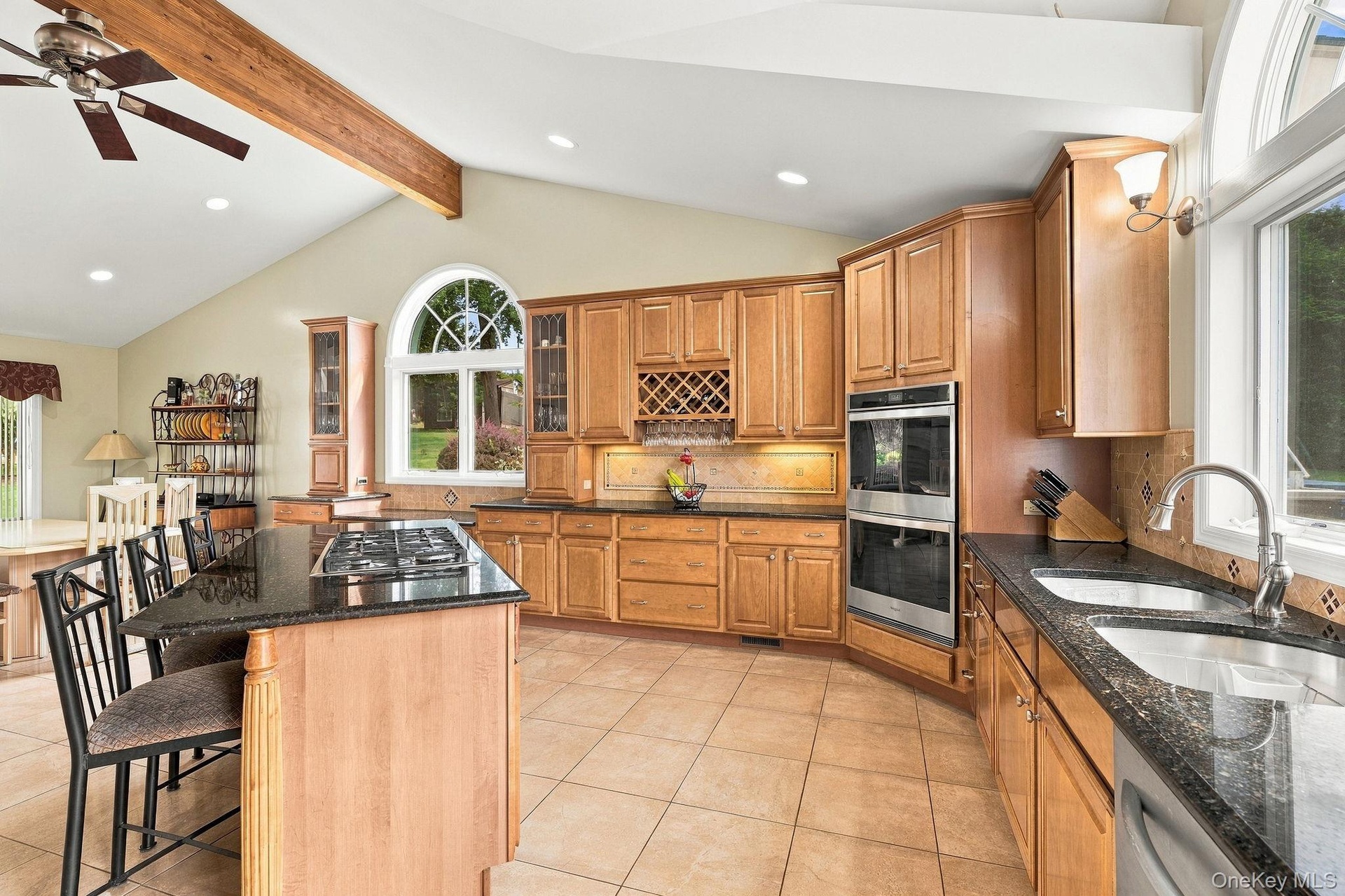 Bathed in natural light and overlooking the grounds, this kitchen commands attention.