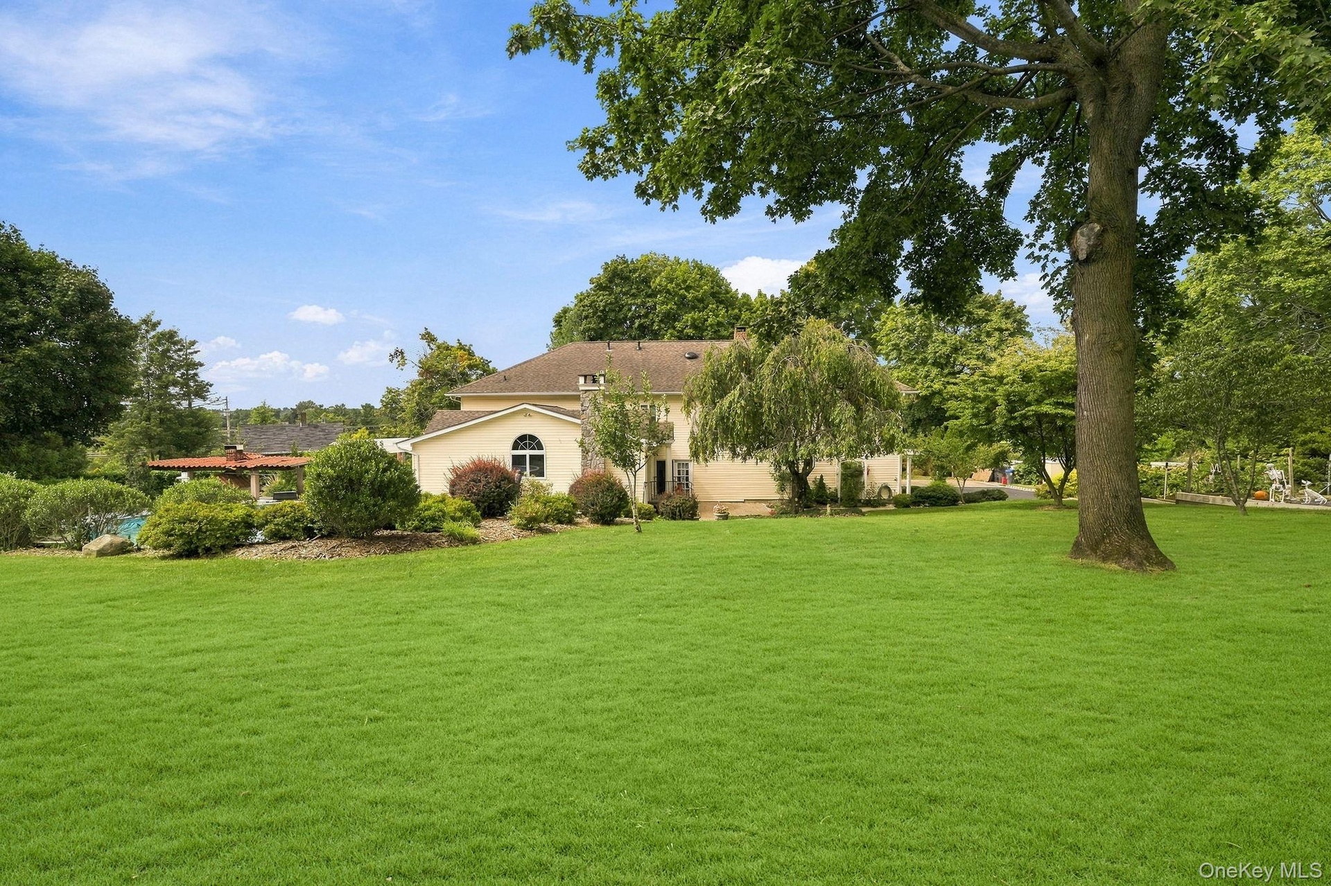 Manicured grounds unfold into private spaces for dining, lounging and recreation.