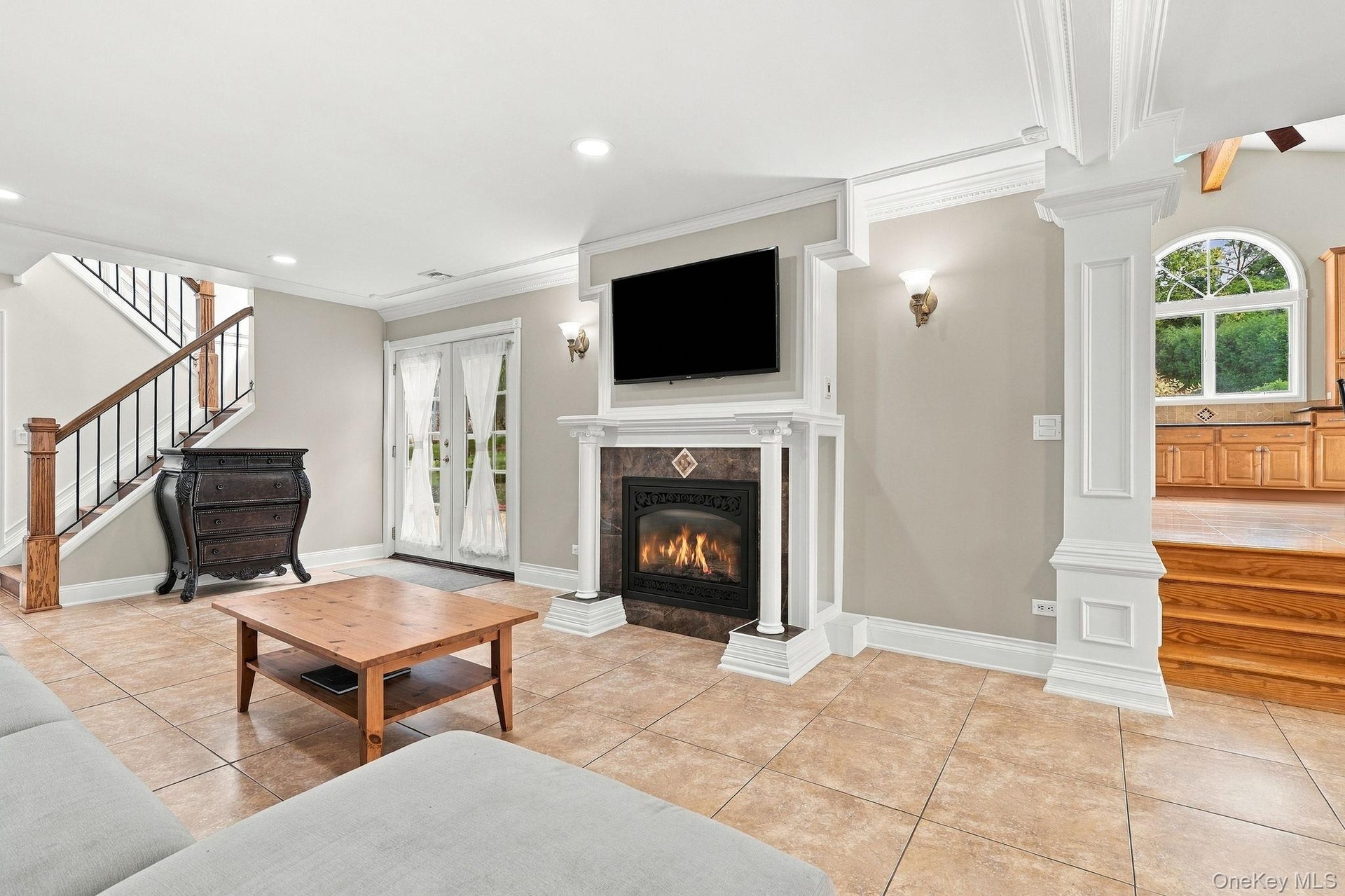 A welcoming family room centered around a handsome gas fireplace.