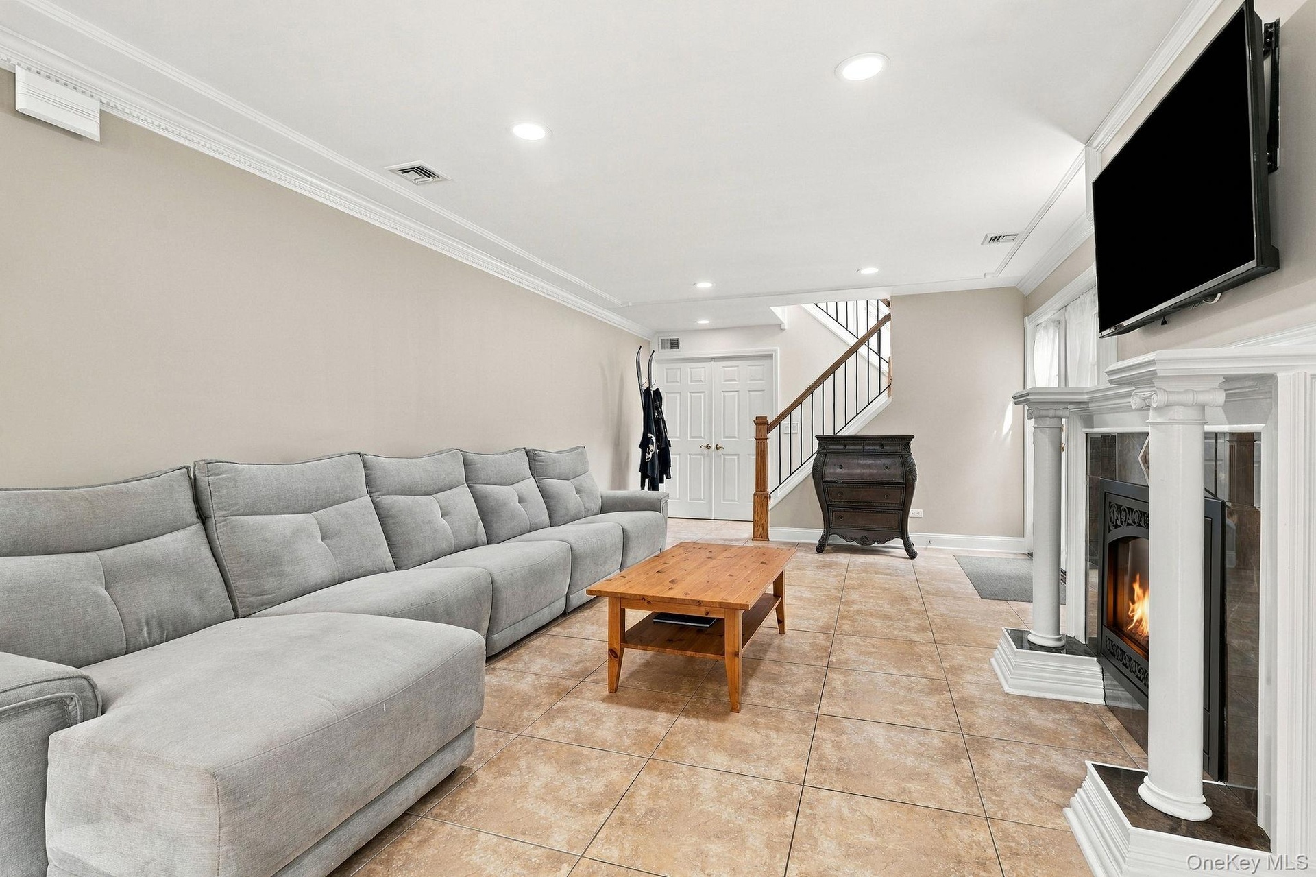 Comfort and elegance come together in this beautifully appointed family room.