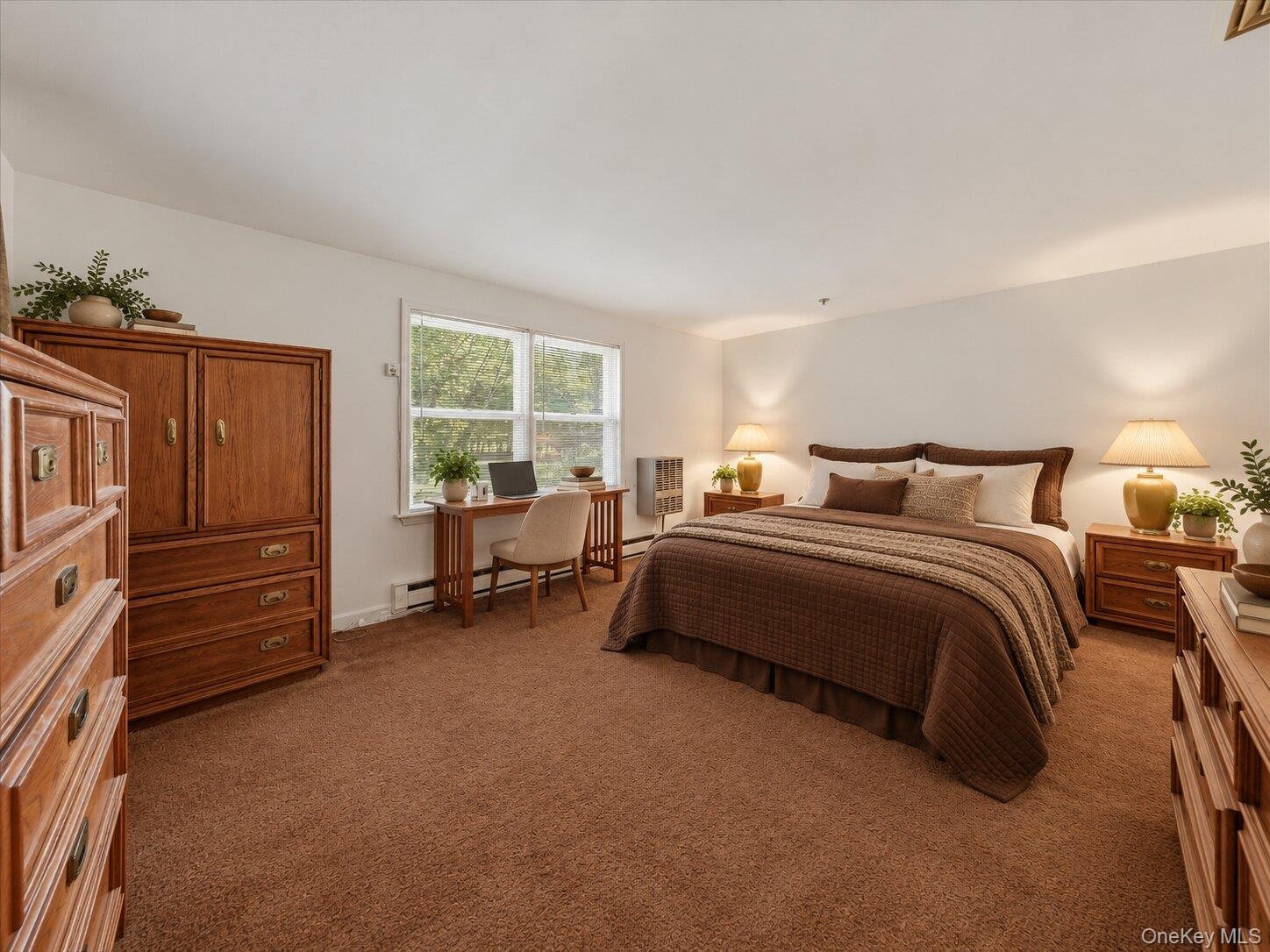 Virtually staged primary bedroom showcasing the spacious layout, natural light, and potential for a dedicated work area.