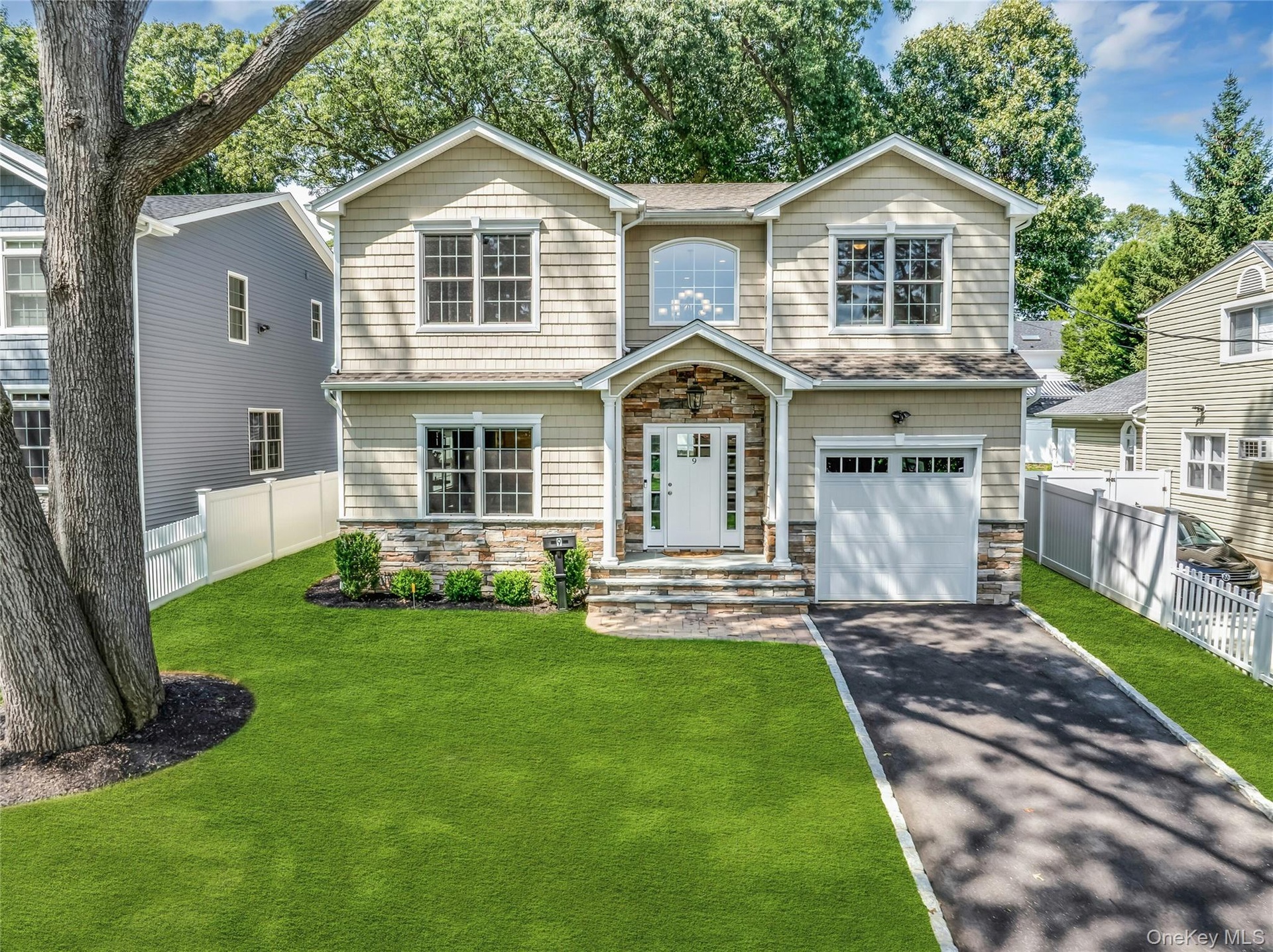 Colonial with one car garage.