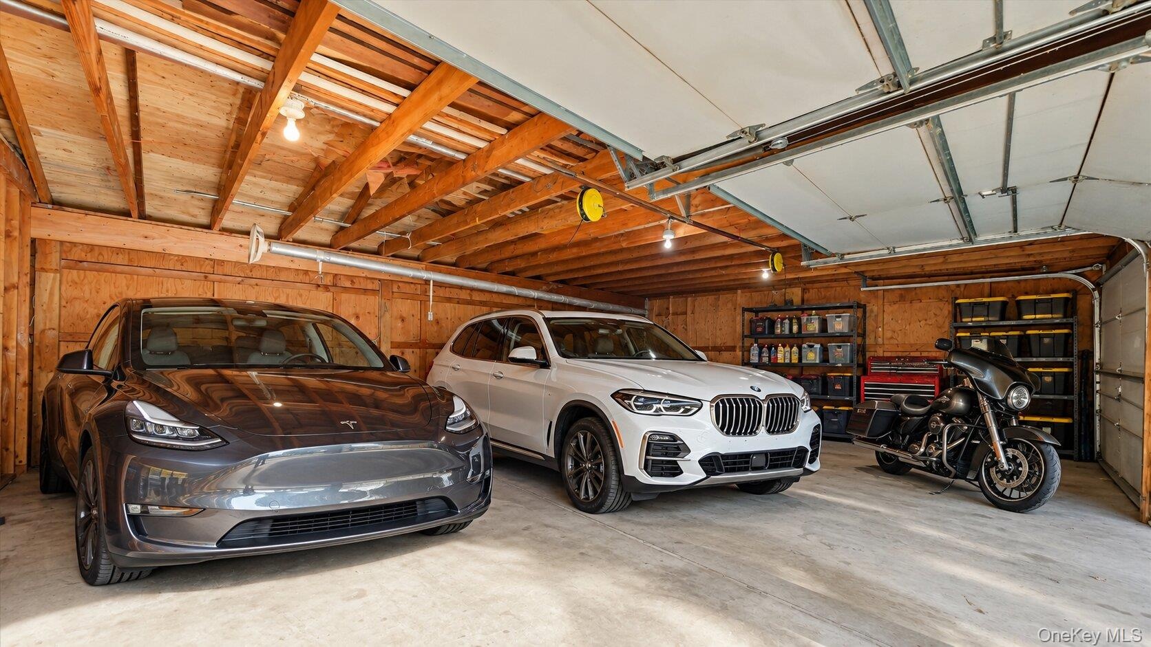 Virtually Staged garage highlighting the generous floor area, vehicle capacity, and storage potential.