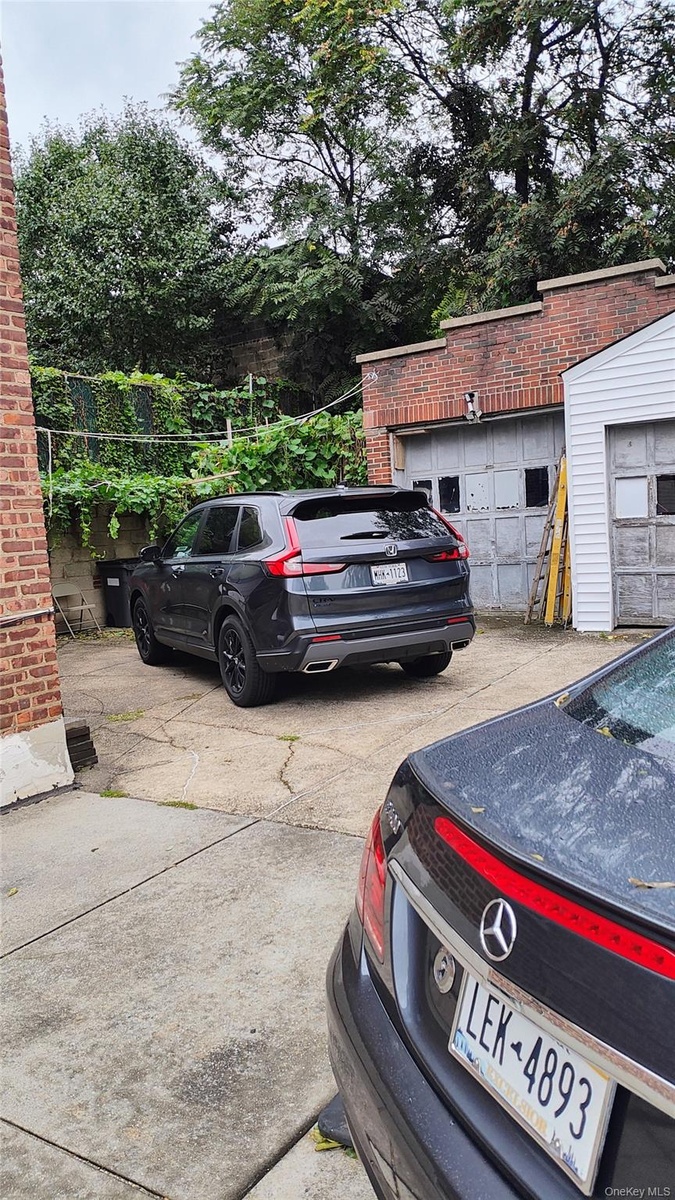 Two Car Garage And Parking Area