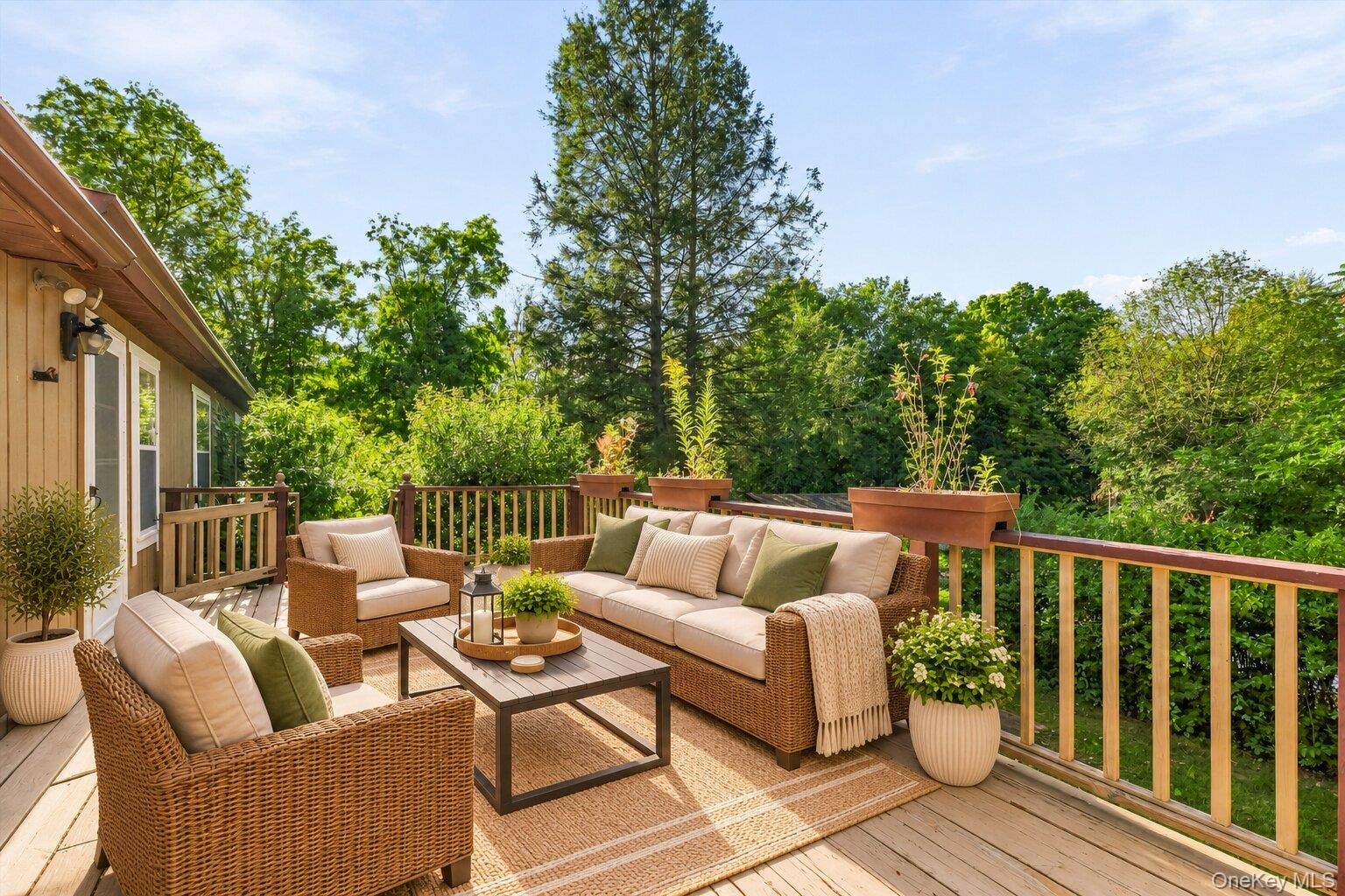 Virtually staged deck highlighting the peaceful backyard views and generous outdoor living space.