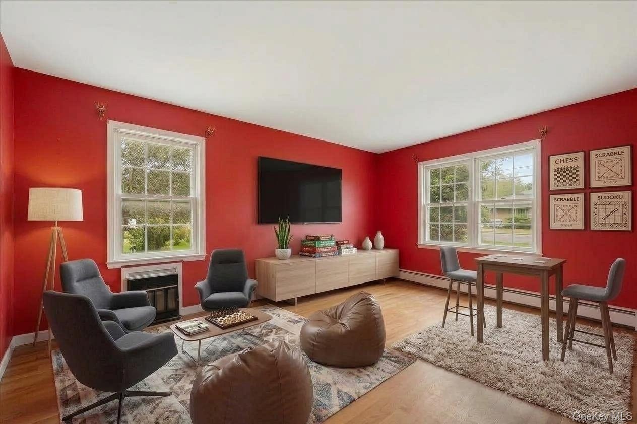 Virtually staged to show the spaciousness of the family room.