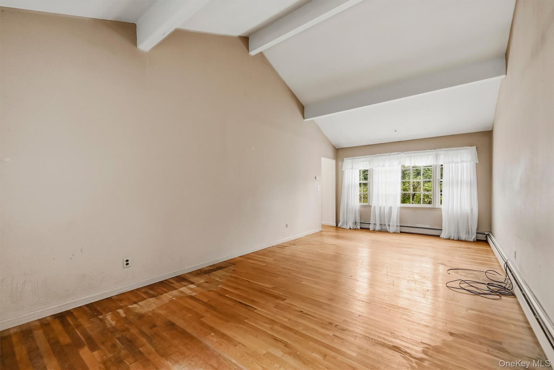 Hardwood floors and oversized windows for plenty of sunshine.