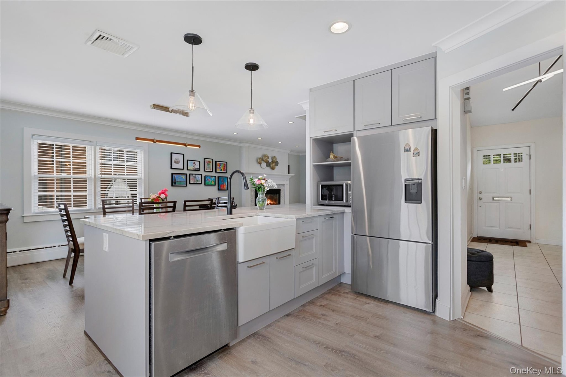 Contemporary kitchen with island and farmhouse sink.