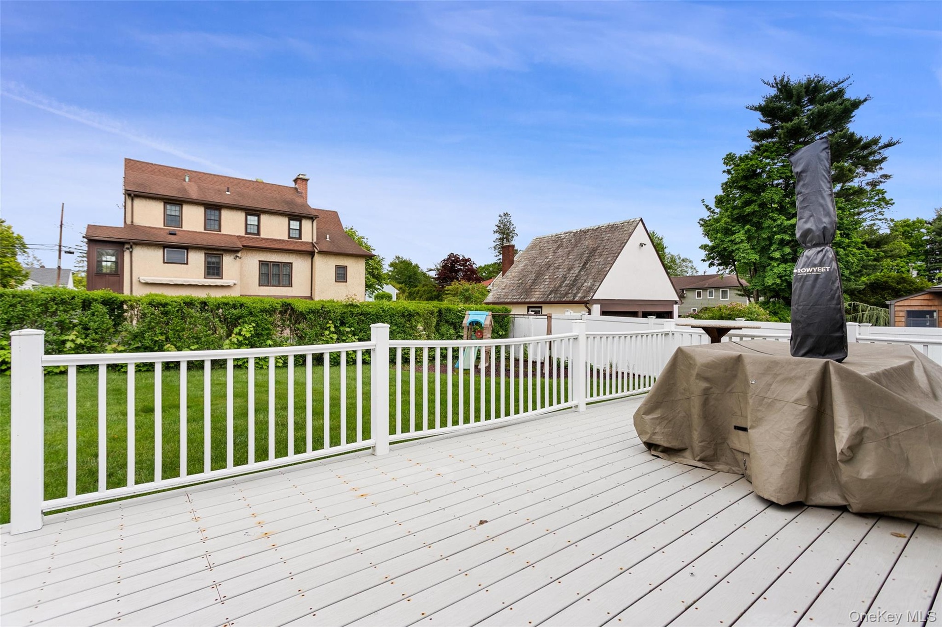 Outdoor deck with white railing.