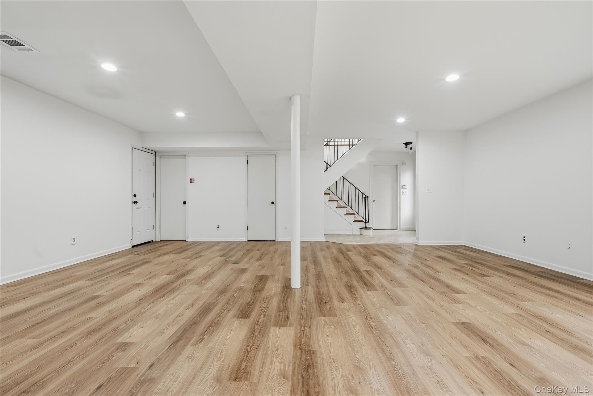 Lower level with brand new floors & fresh paint.