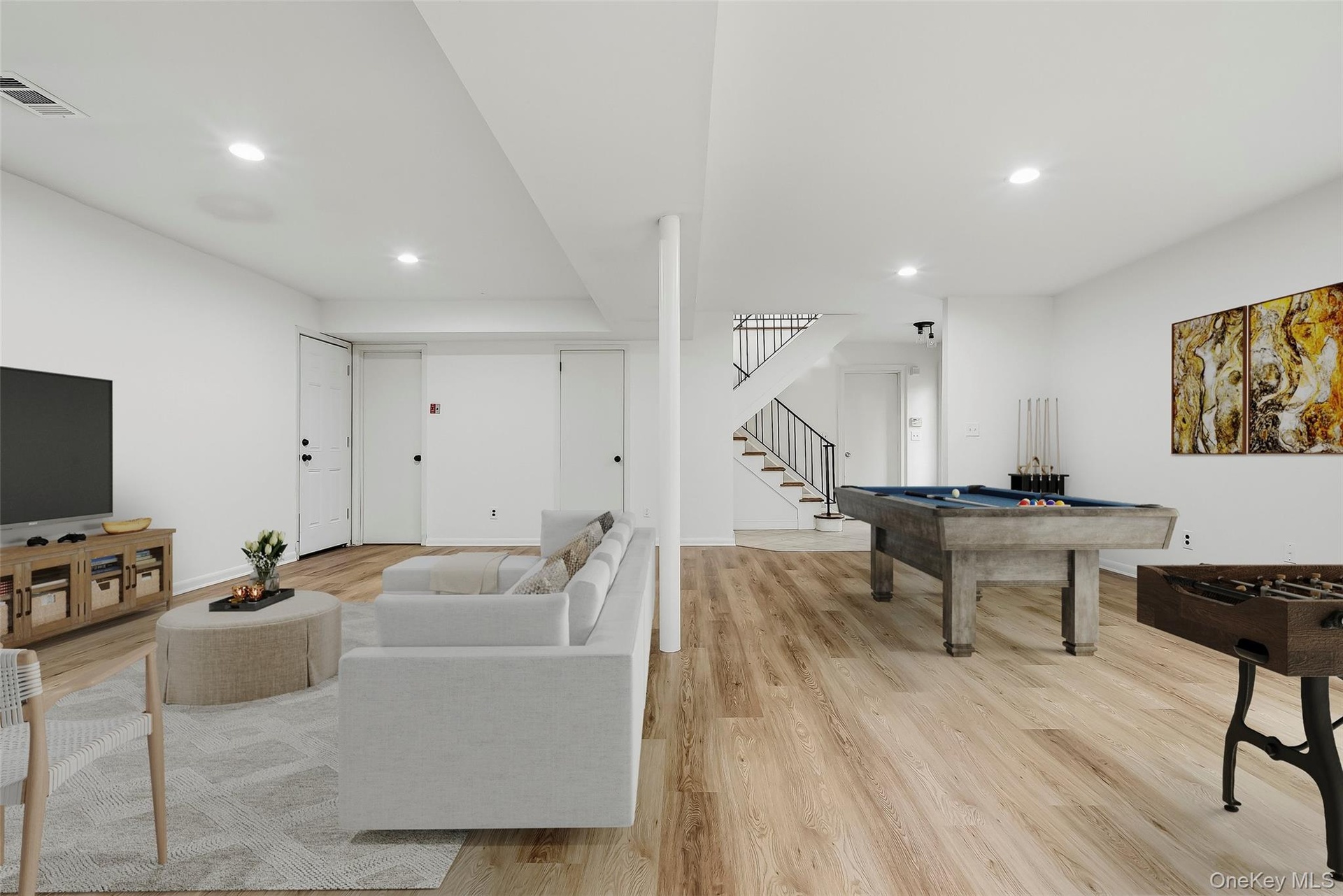 Virtually staged lower level with brand new floors & fresh paint.