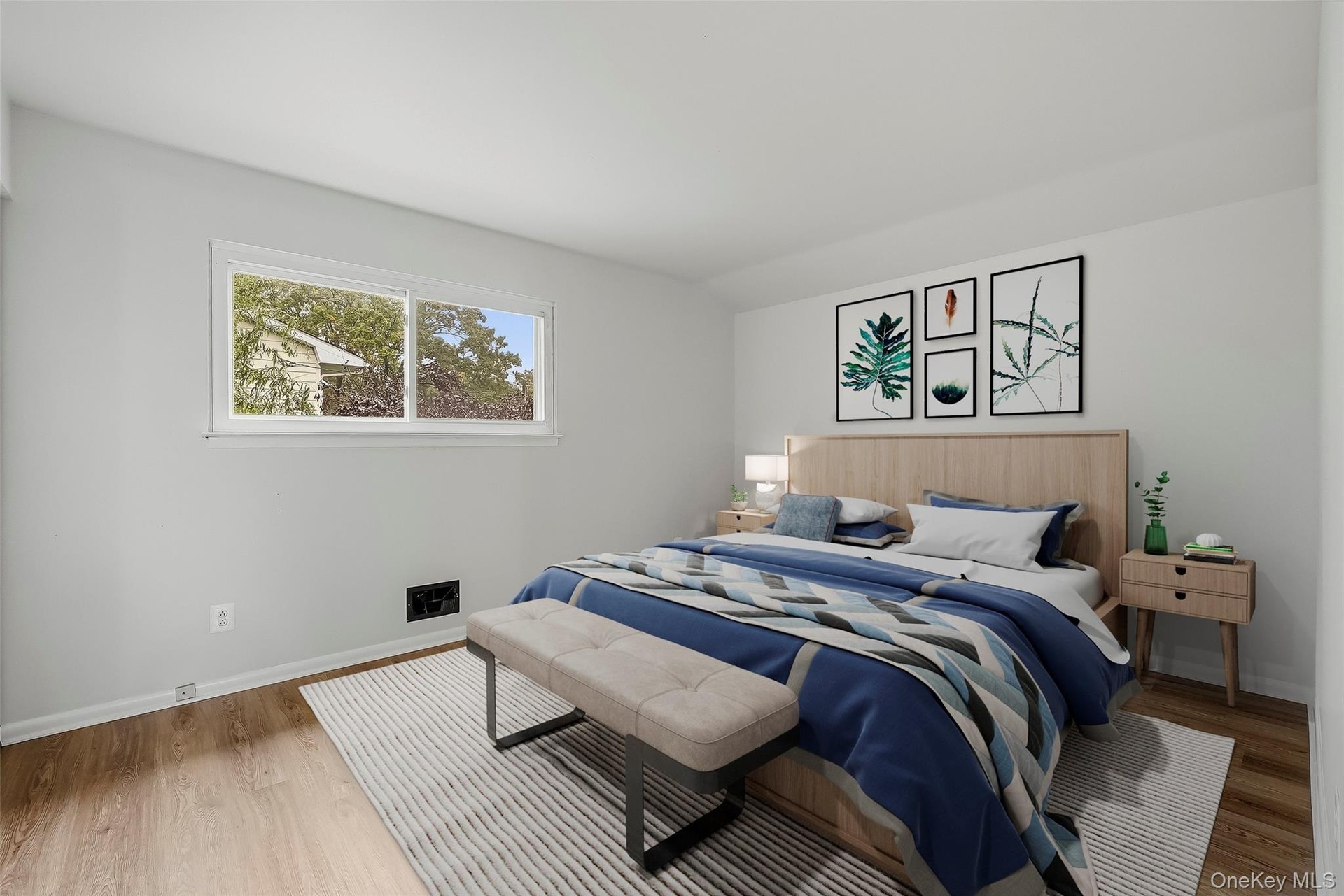 Virtually staged 2nd bedroom with brand new floors.