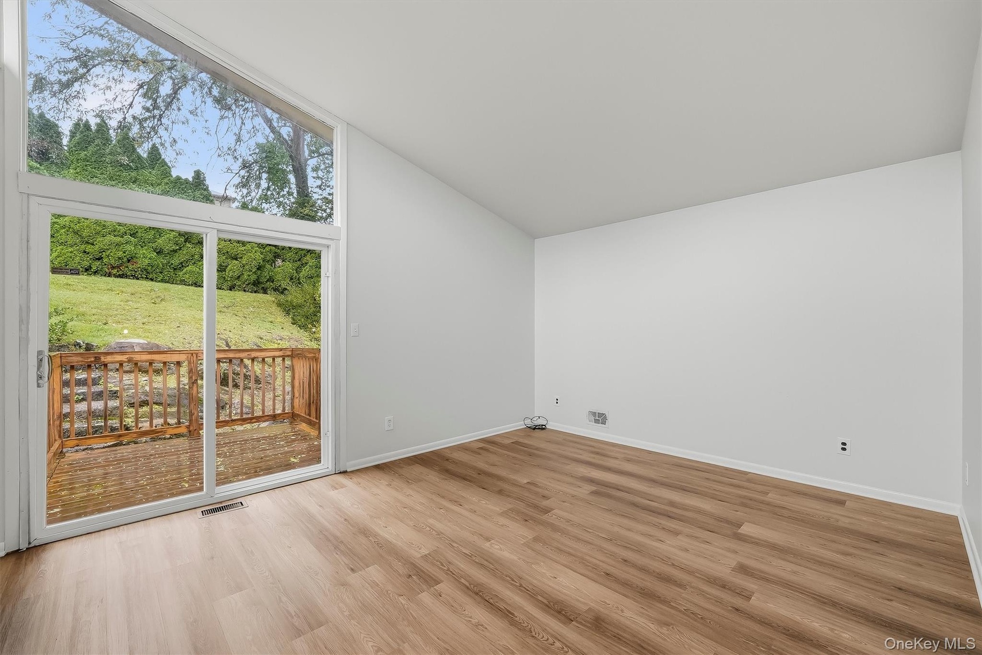 Primary bedroom with brand new floors, en-suite bathroom, & walk-in closet.
