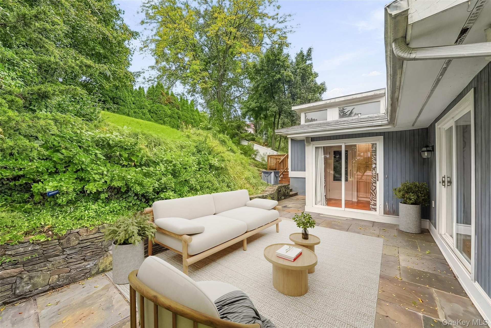Virtually staged blue stone patio.