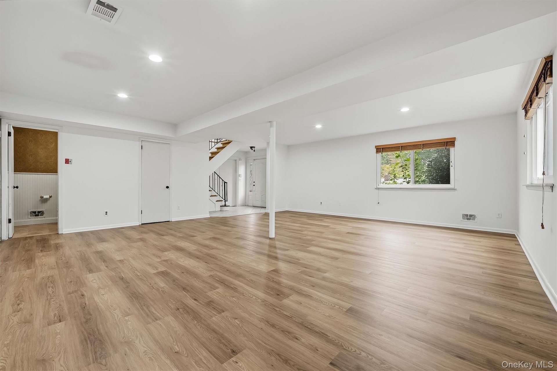 Lower level with brand new floors & fresh paint.