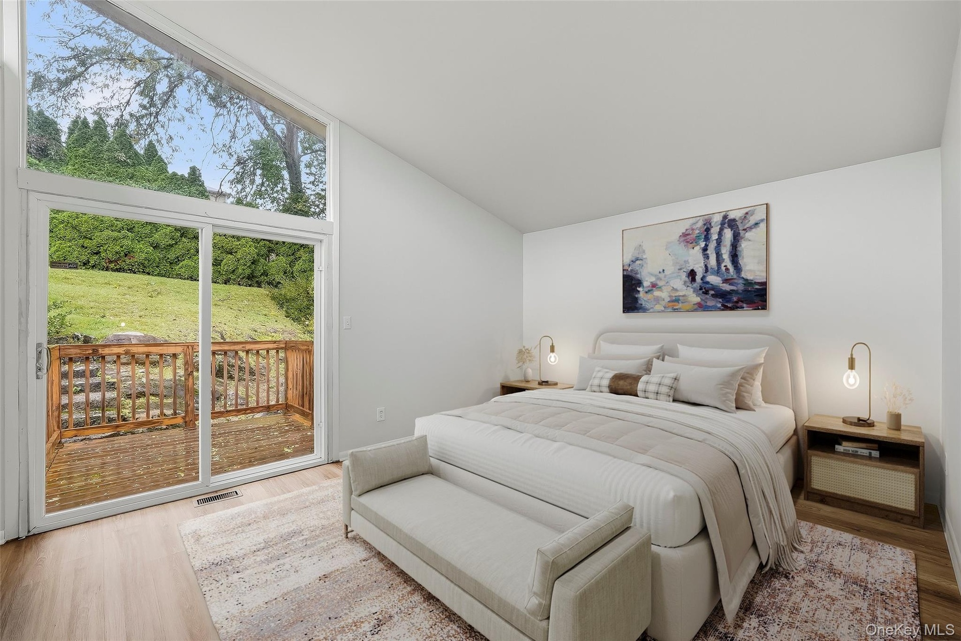 Virtually staged primary bedroom with brand new floors, en-suite bathroom, & walk-in closet.