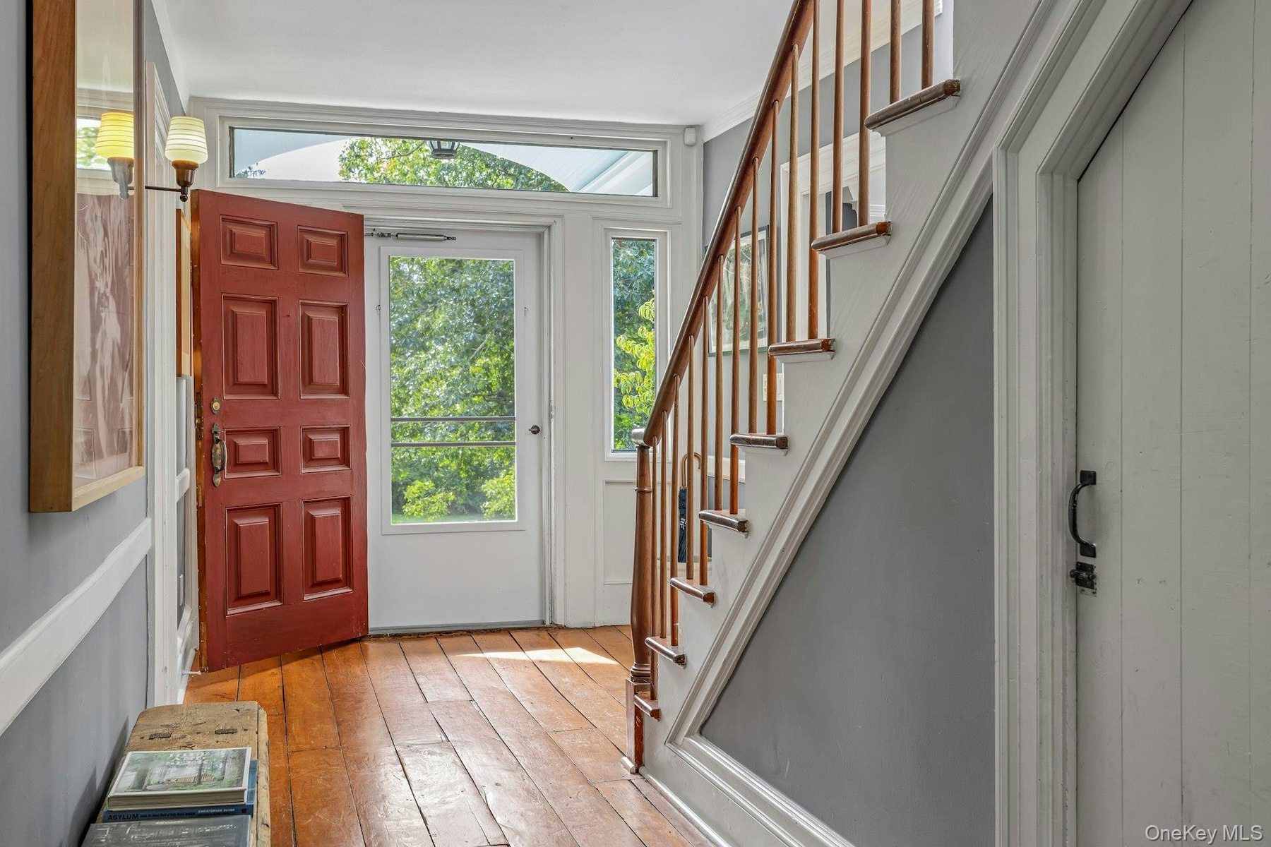 Graciously sized foyer/gallery. Stairs to second level
