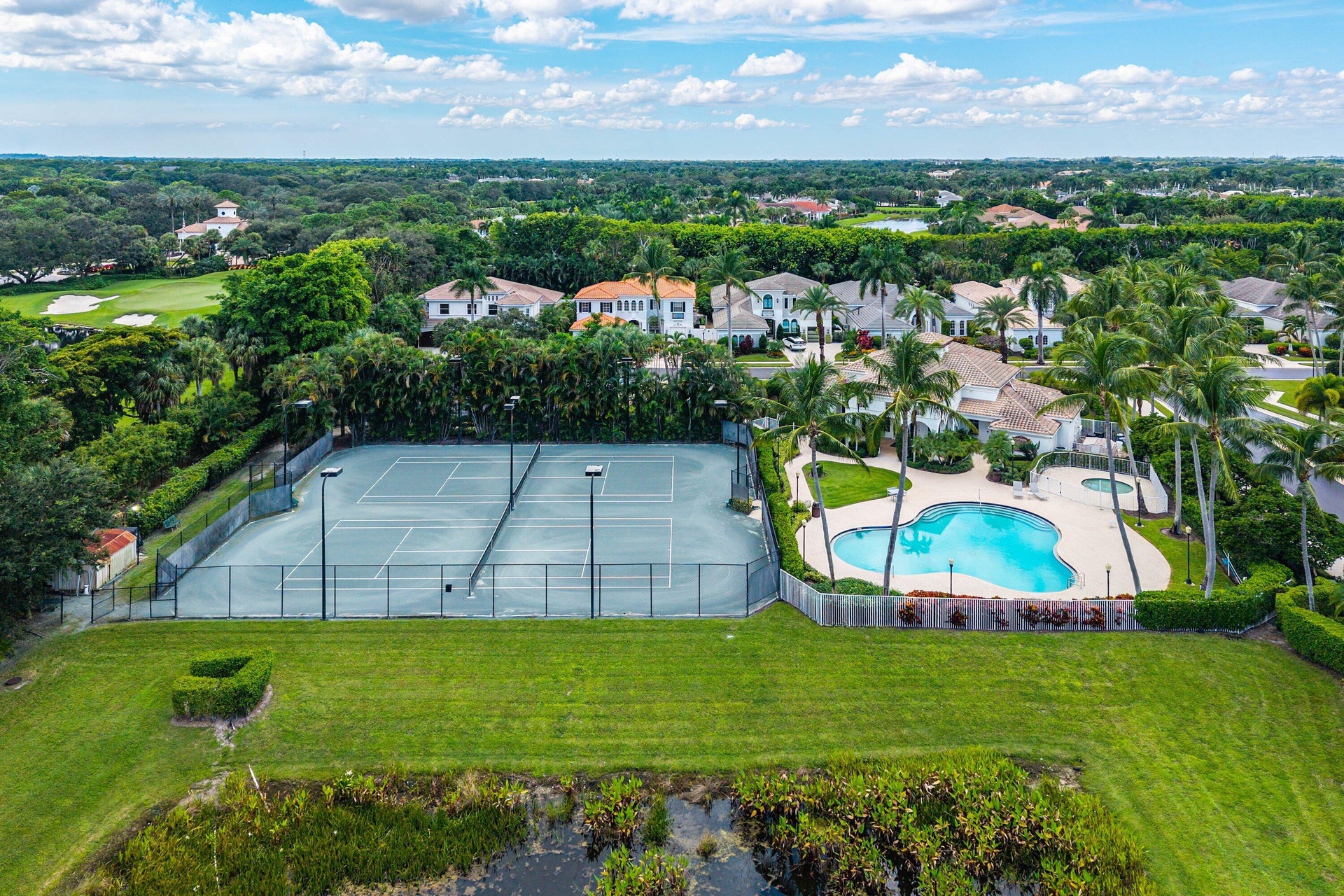 Private tennis courts, resort-style swimming pool, and kiddie pool