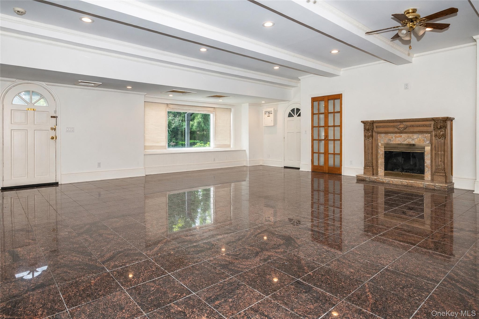1300 sq ft of additional living space with fireplace and walk out to back yard and garage.  AI Generated
