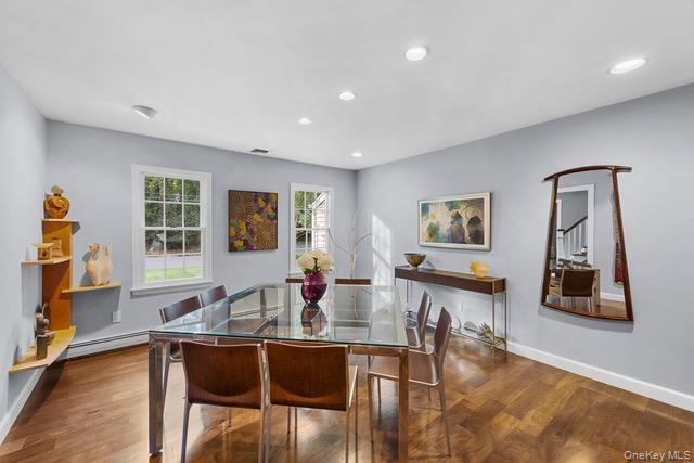 Wood-finish flooring, two windows.