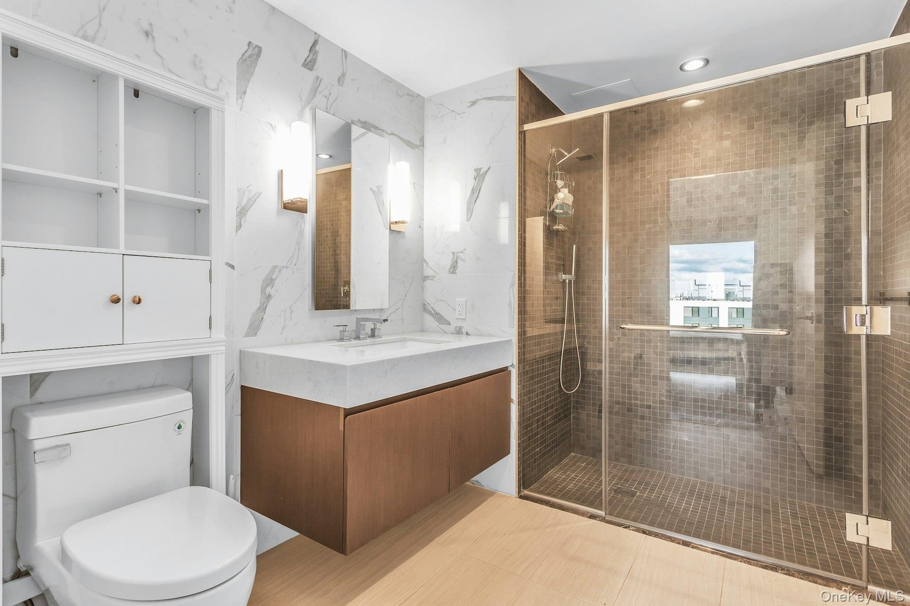 Full bath featuring vanity, a shower stall, tile walls, and recessed lighting