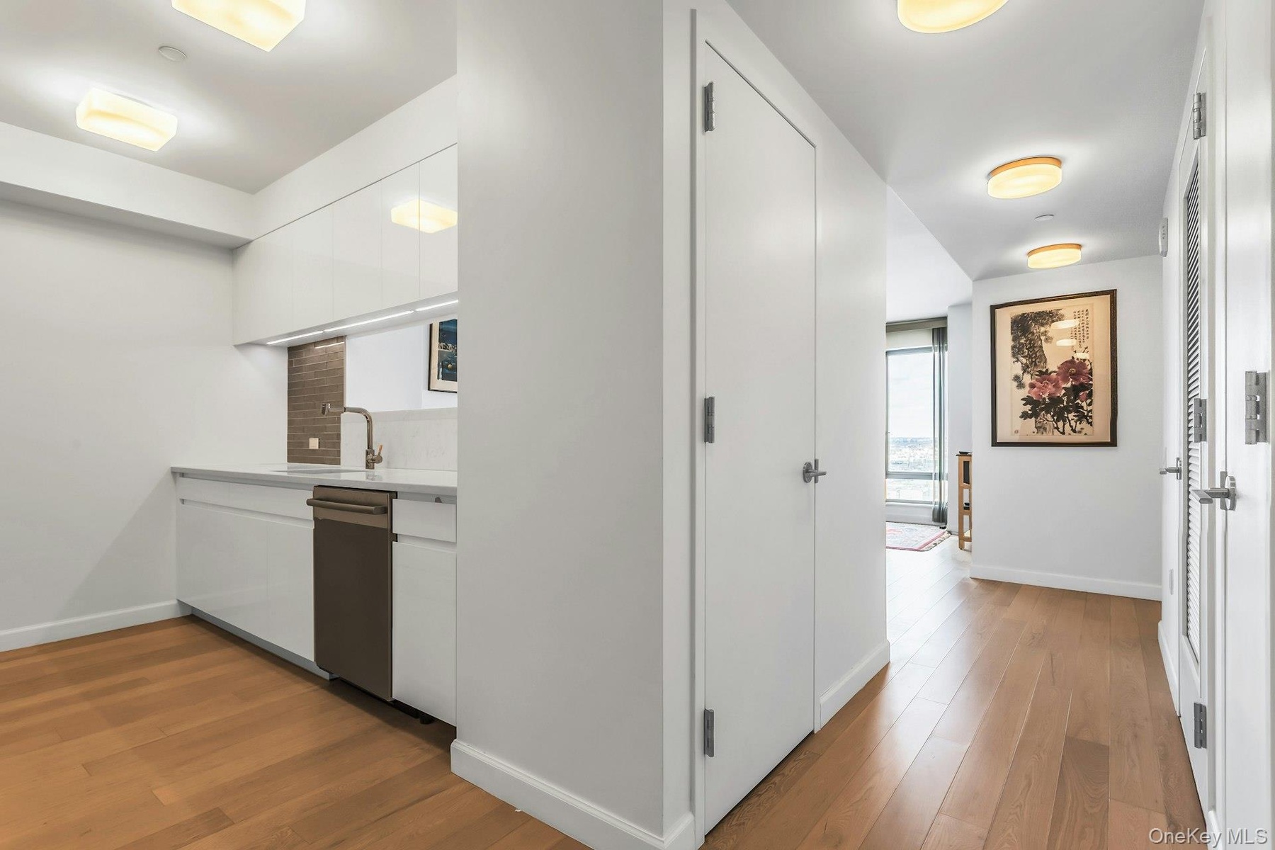 Corridor with light wood finished floors