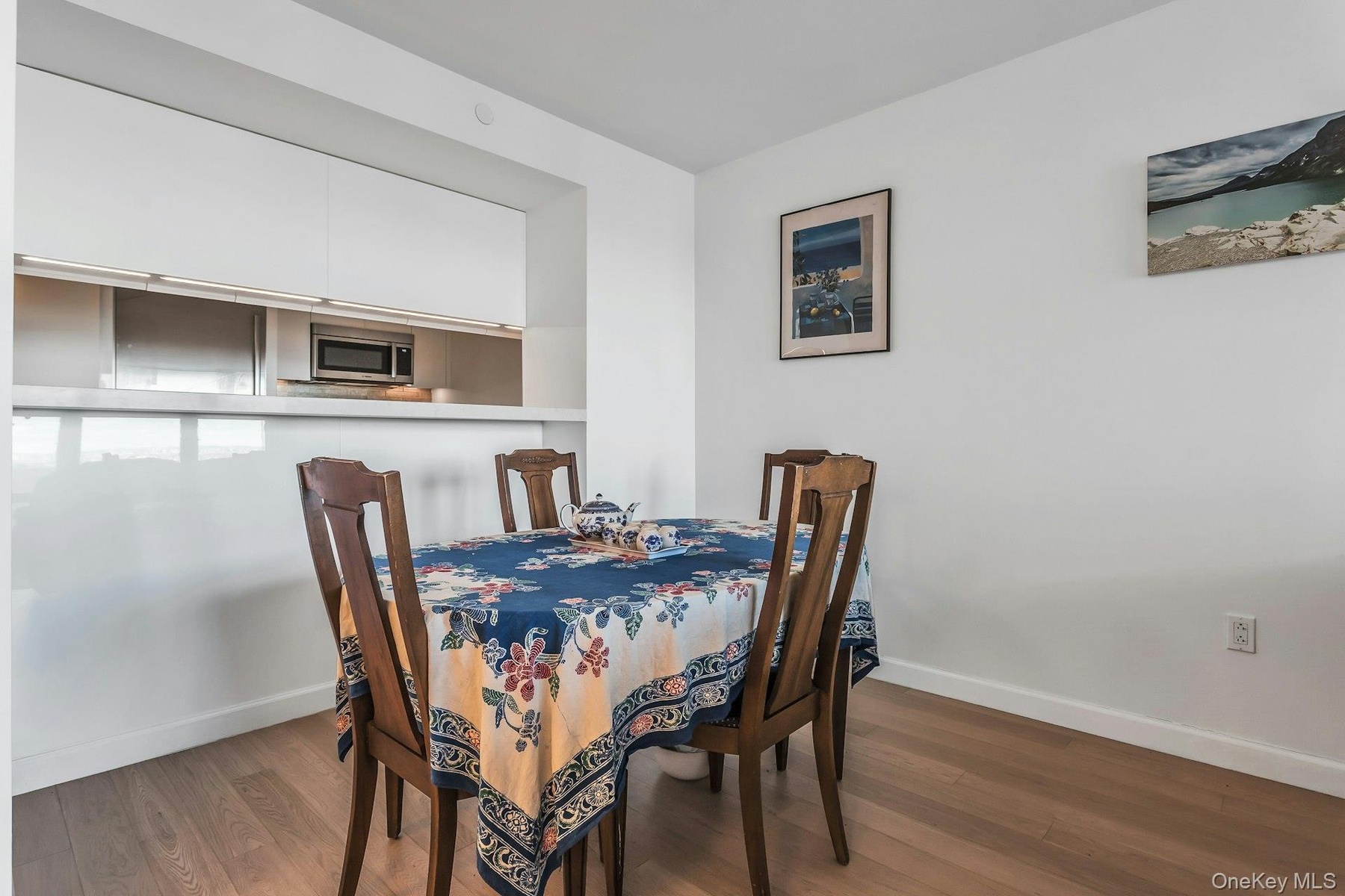 Dining space featuring dark wood-style floors