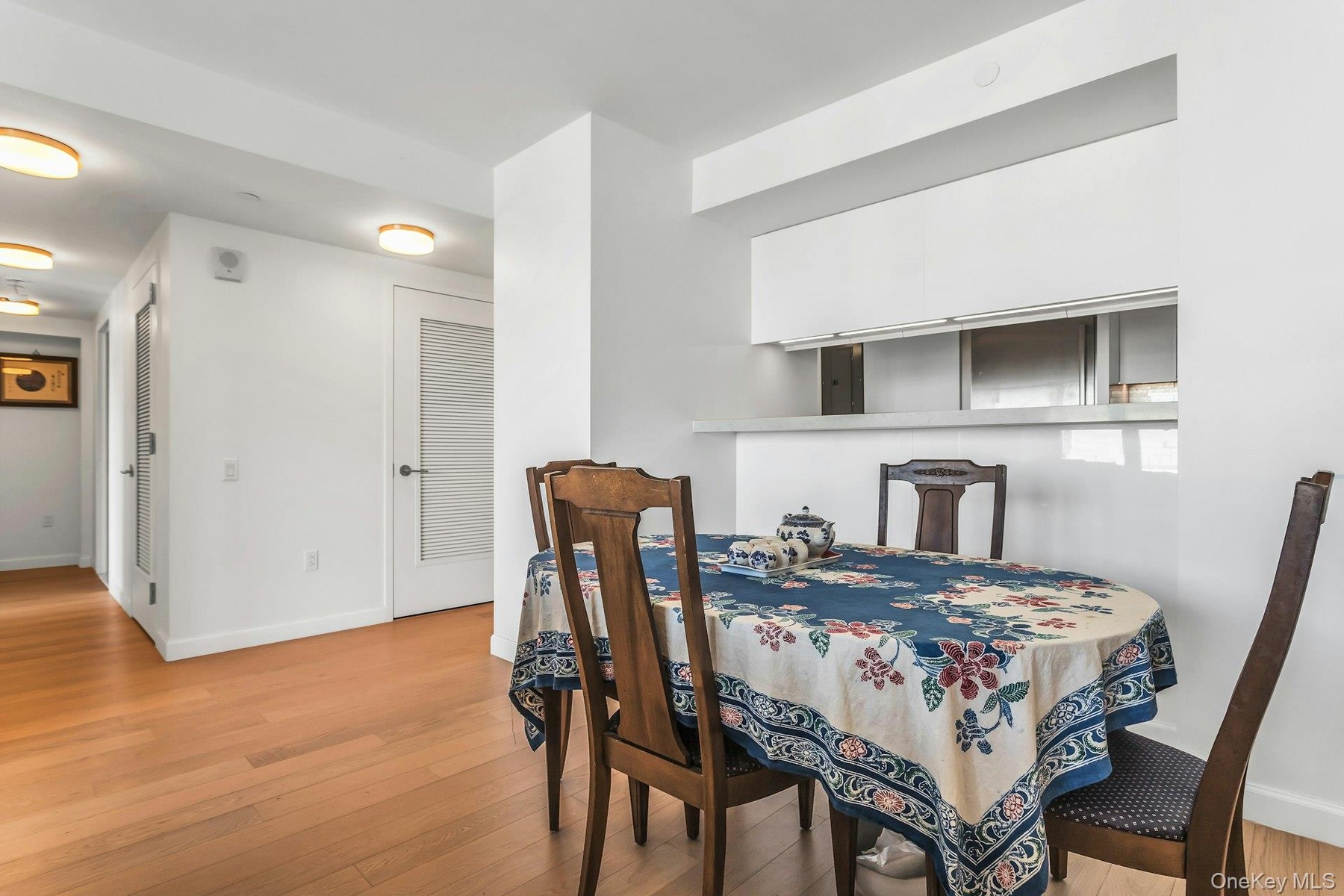 Dining space with light wood-type flooring and baseboards