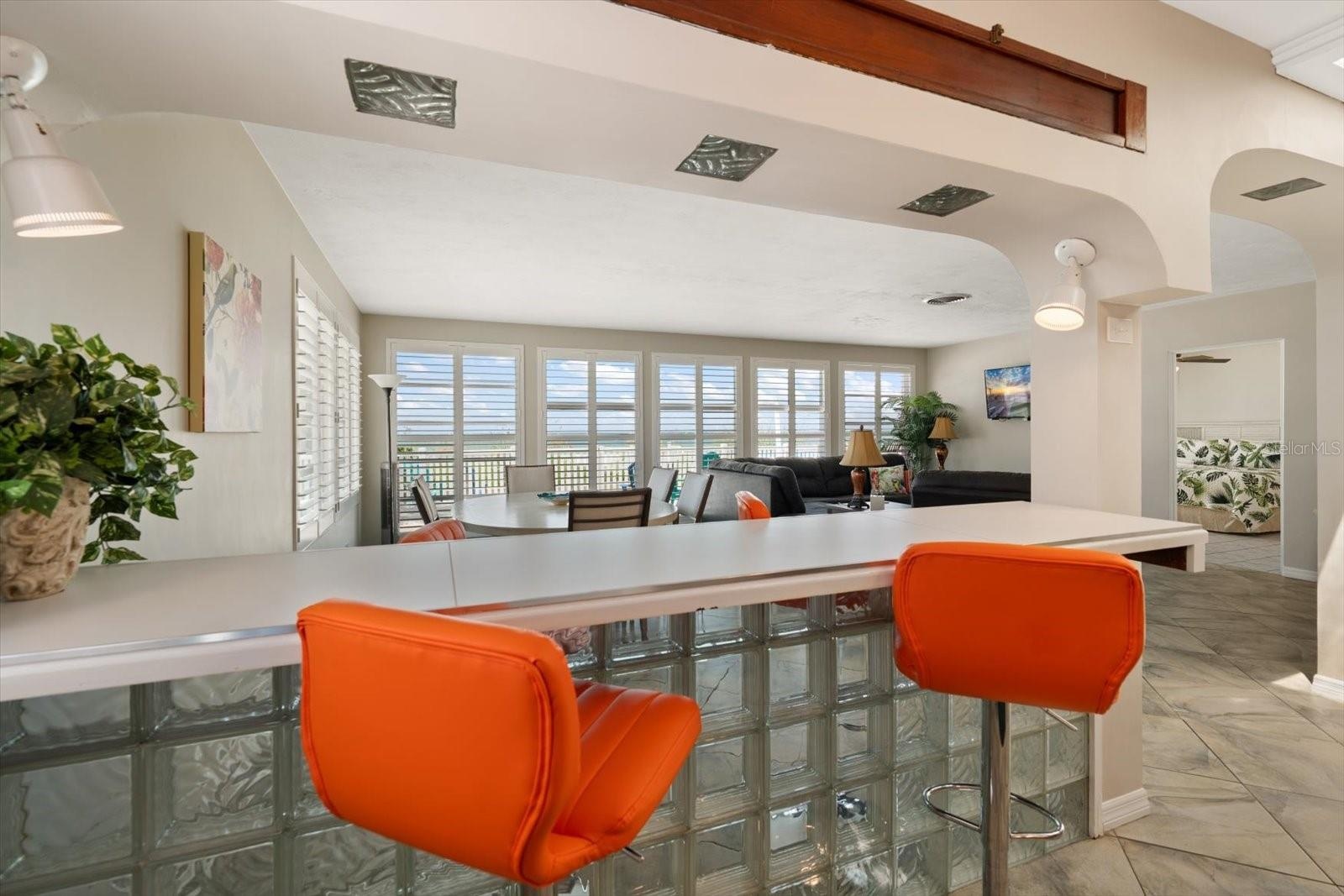 Main home-breakfast bar overlooking dining and living areas.