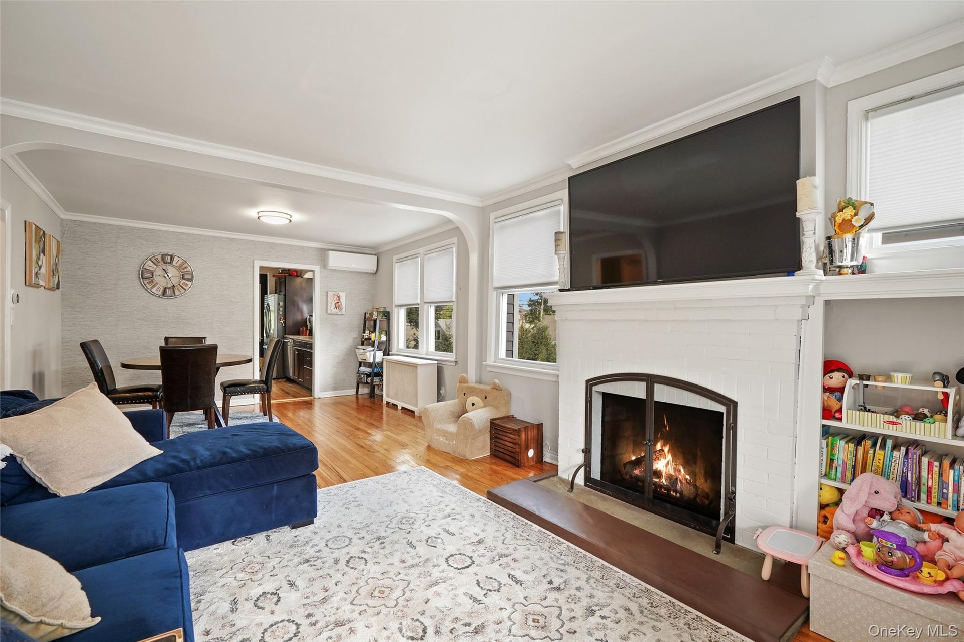 Open family and dining room with wood-burning fireplace