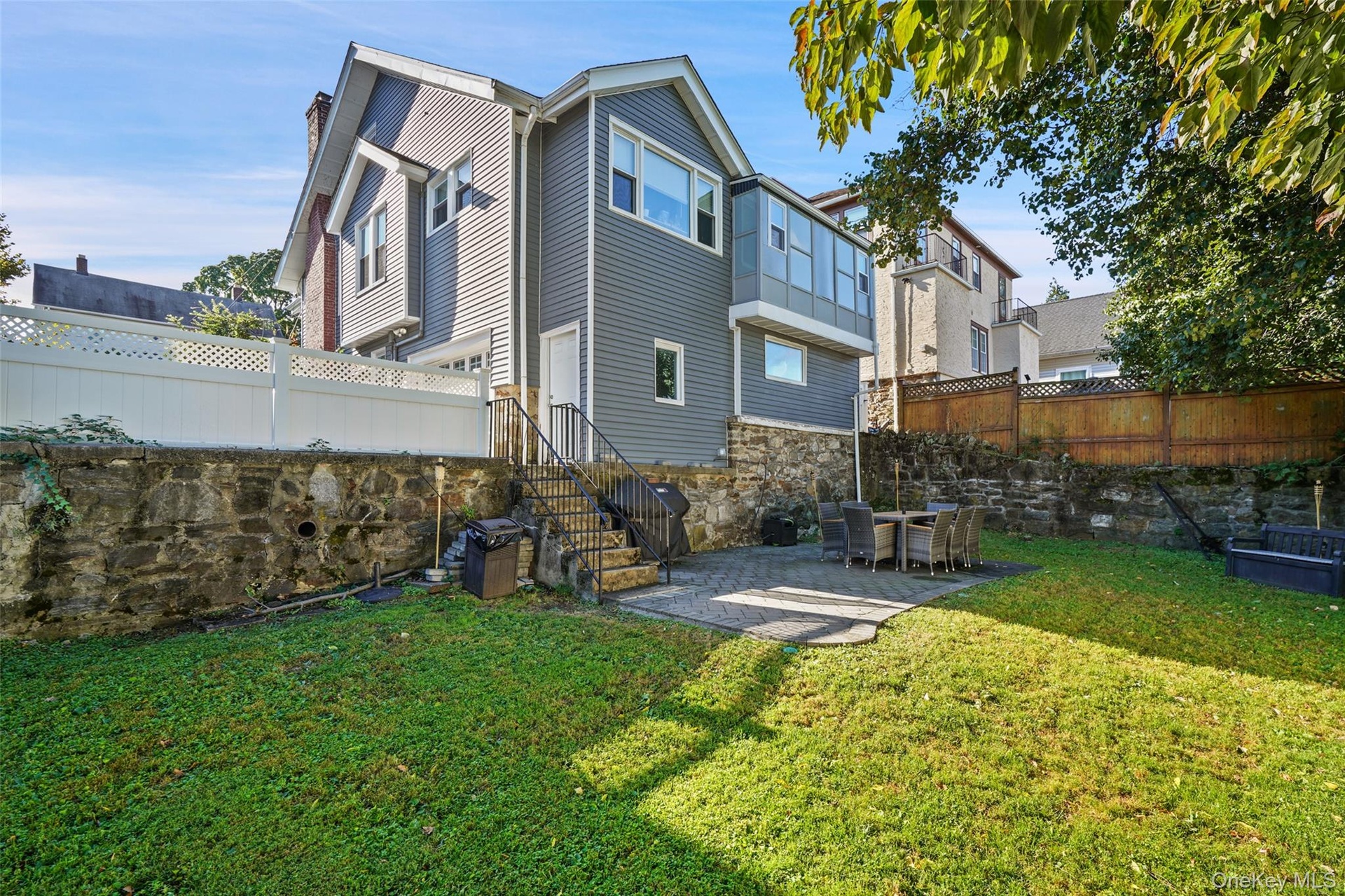 Large, fenced in yard with plenty of space to entertain, grill and play