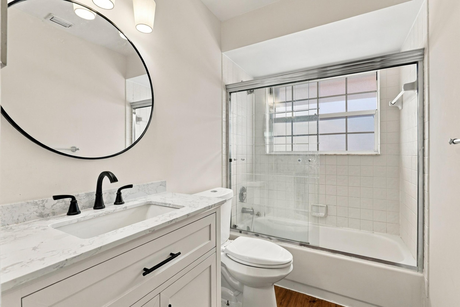 Beautifully renovated with an elegant, timeless design, the second-floor guest bathroom conveniently serves both guest bedrooms and the versatile loft