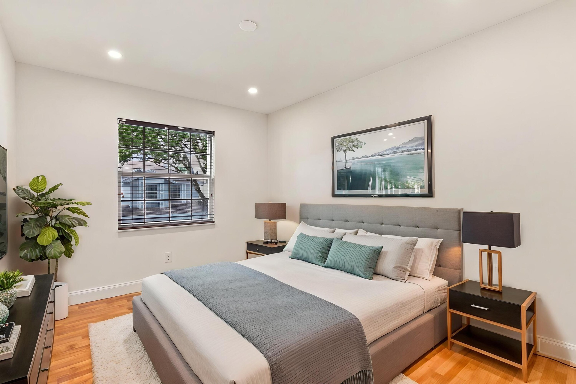 Both upstairs guest bedrooms are generously sized and filled with natural light, offering ample closet space and comfortable accommodations for family
