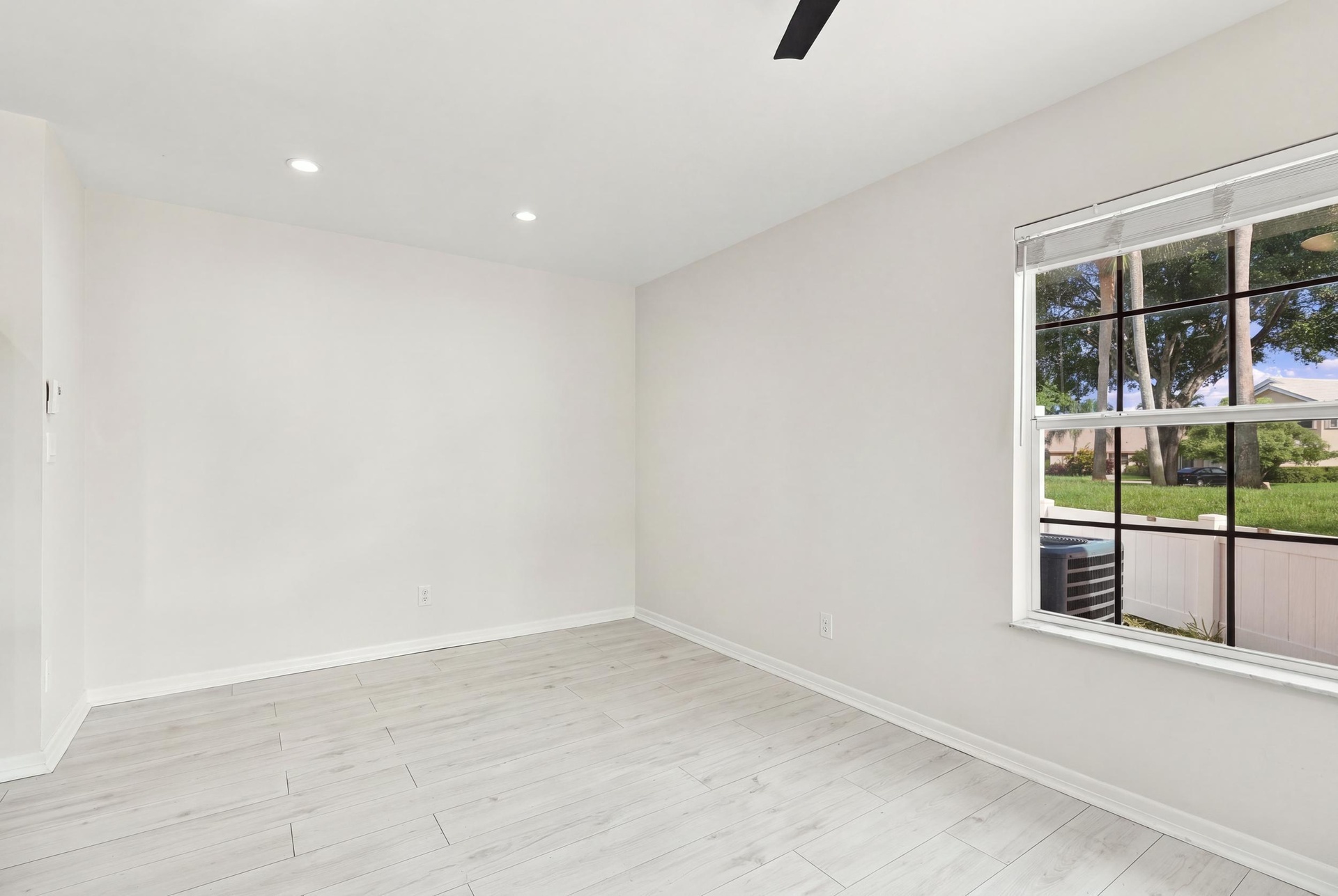 The charming eat-in dining area provides a relaxed and convenient setting for casual meals, surrounded by natural light with sliding glass doors openi