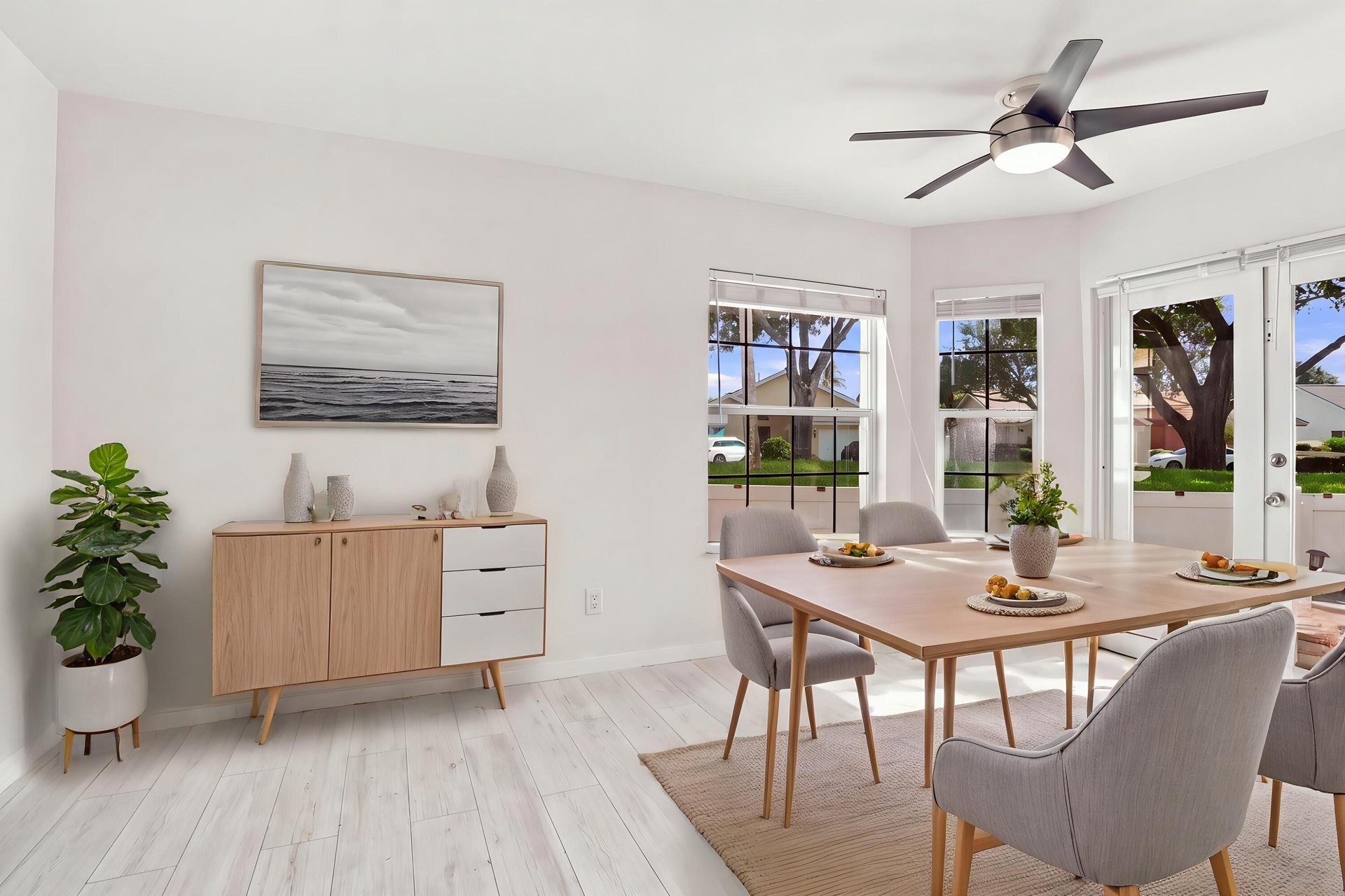 The charming eat-in dining area provides a relaxed and convenient setting for casual meals, surrounded by natural light with sliding glass doors openi