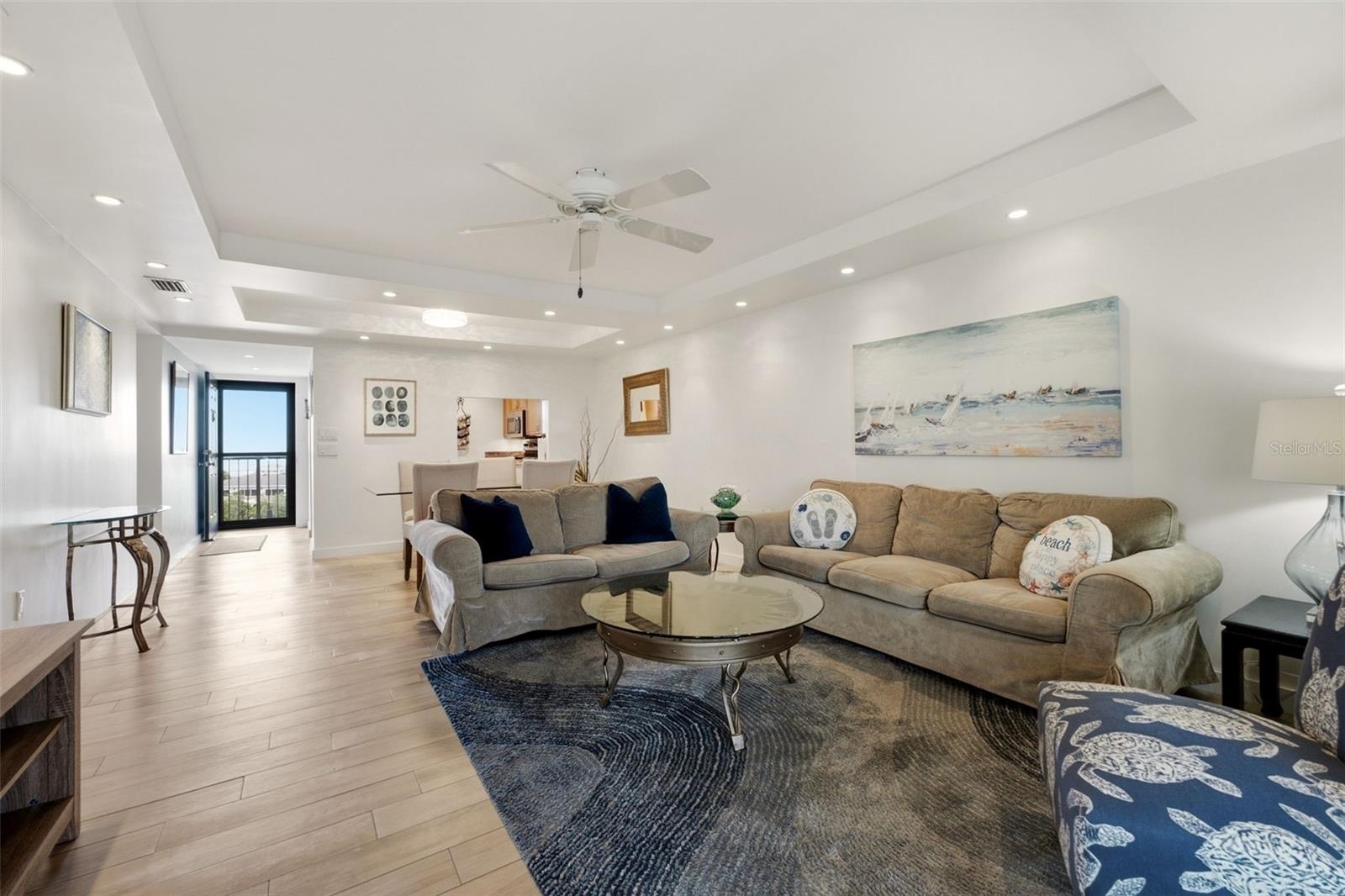 Open living and dining area with a seamless flow to the balcony and  lanai.