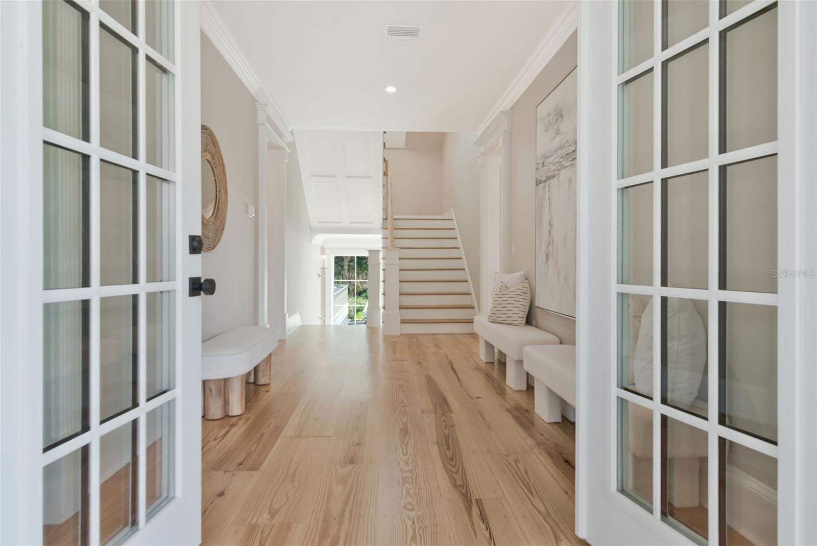 Welcoming French doors on floors one and two