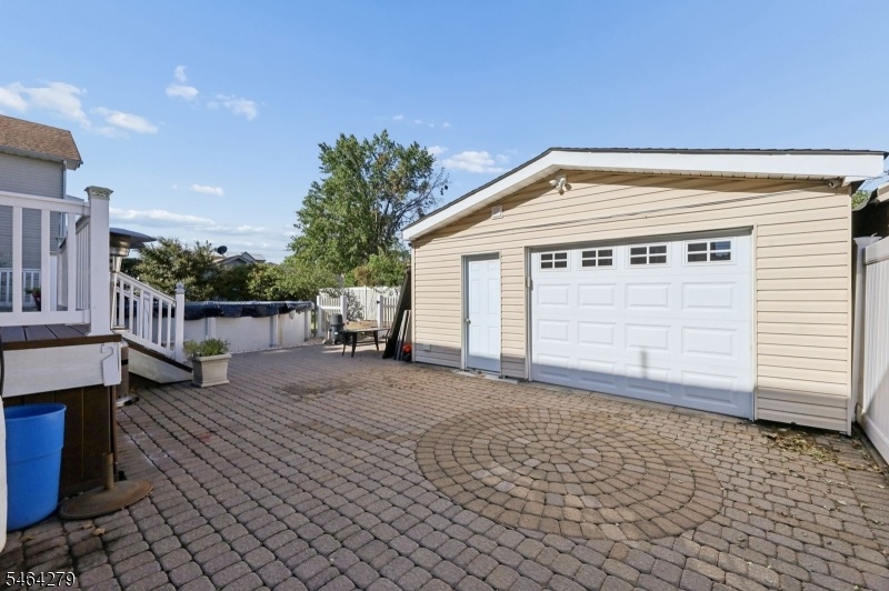 LARGE GARAGE AND PAVER BACK