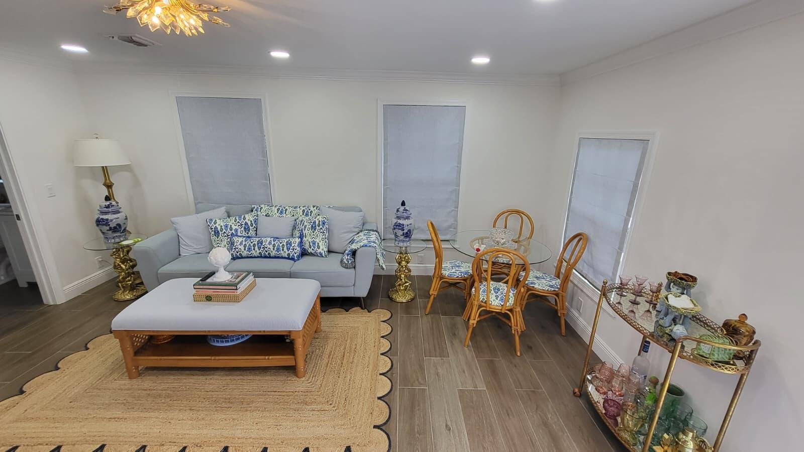 Recessed lighting, wood-finish flooring, and white walls