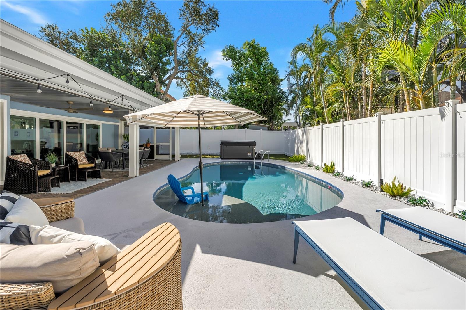 Heated AND Chilled six feet deep saltwater pool with sun shelf and umbrella option.