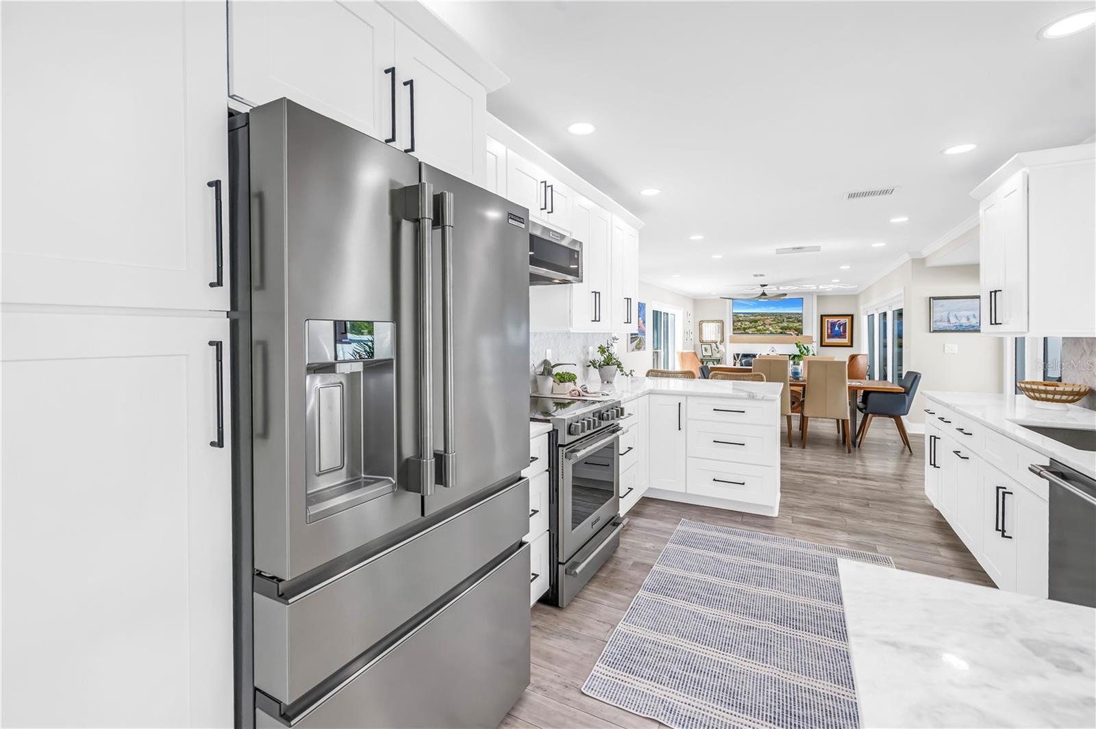 Stainless steel French style three drawer refrigerator and lots of panty space.