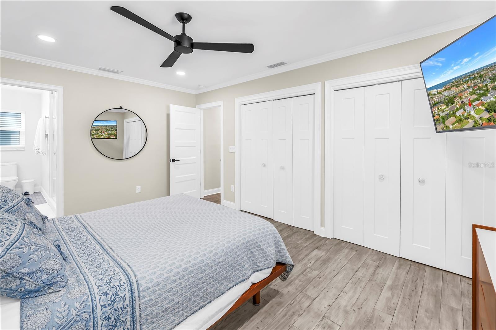 Double closets in Primary Suite with custom built in organizers.